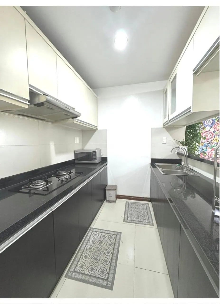 Kitchen or kitchenette in Chillax Apartment - Cozy 3-Bedroom City View Home at Tower, District 1