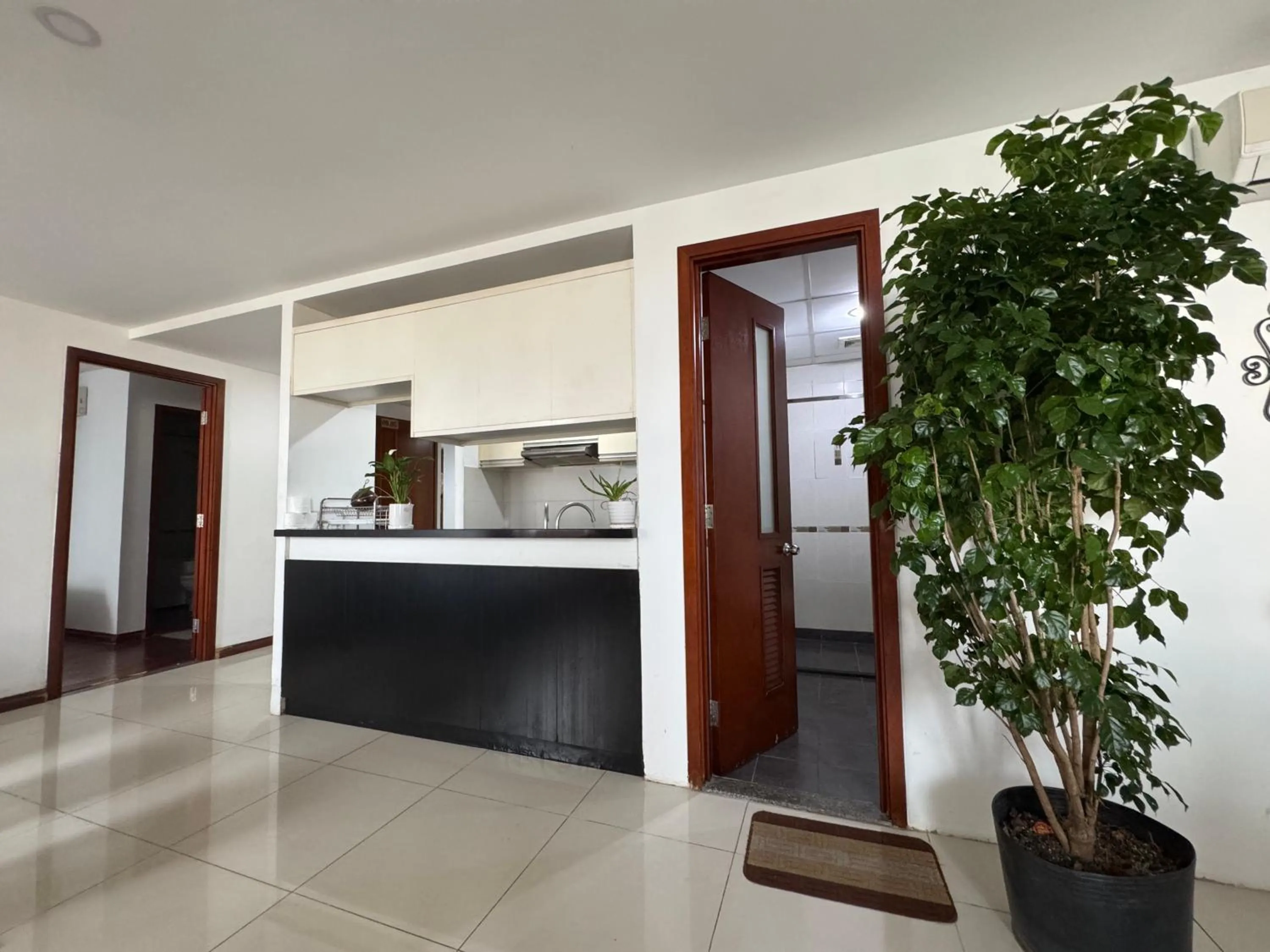 kitchen in Chillax Apartment - Cozy 3-Bedroom City View Home at Tower, District 1