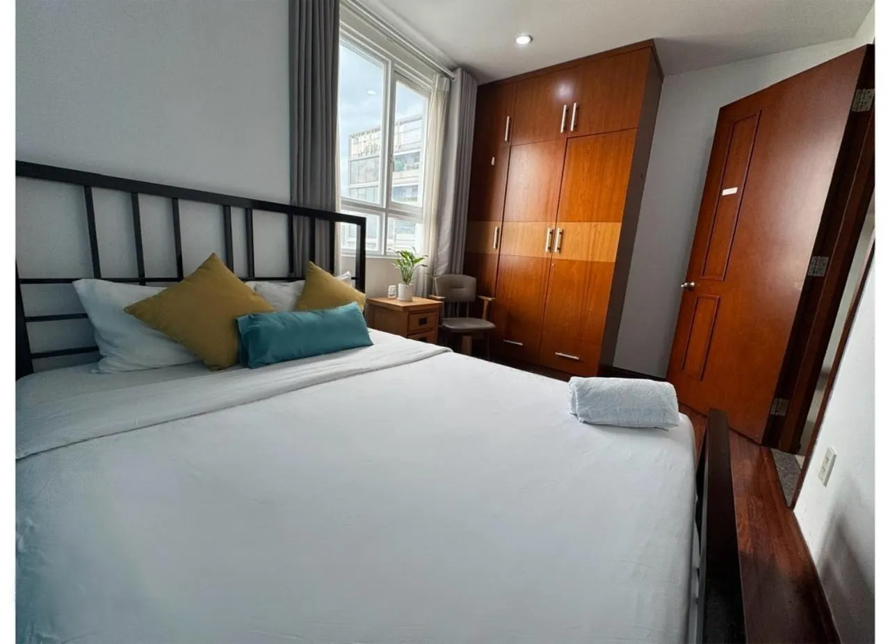 Bedroom, Bed in Chillax Apartment - Cozy 3-Bedroom City View Home at Tower, District 1