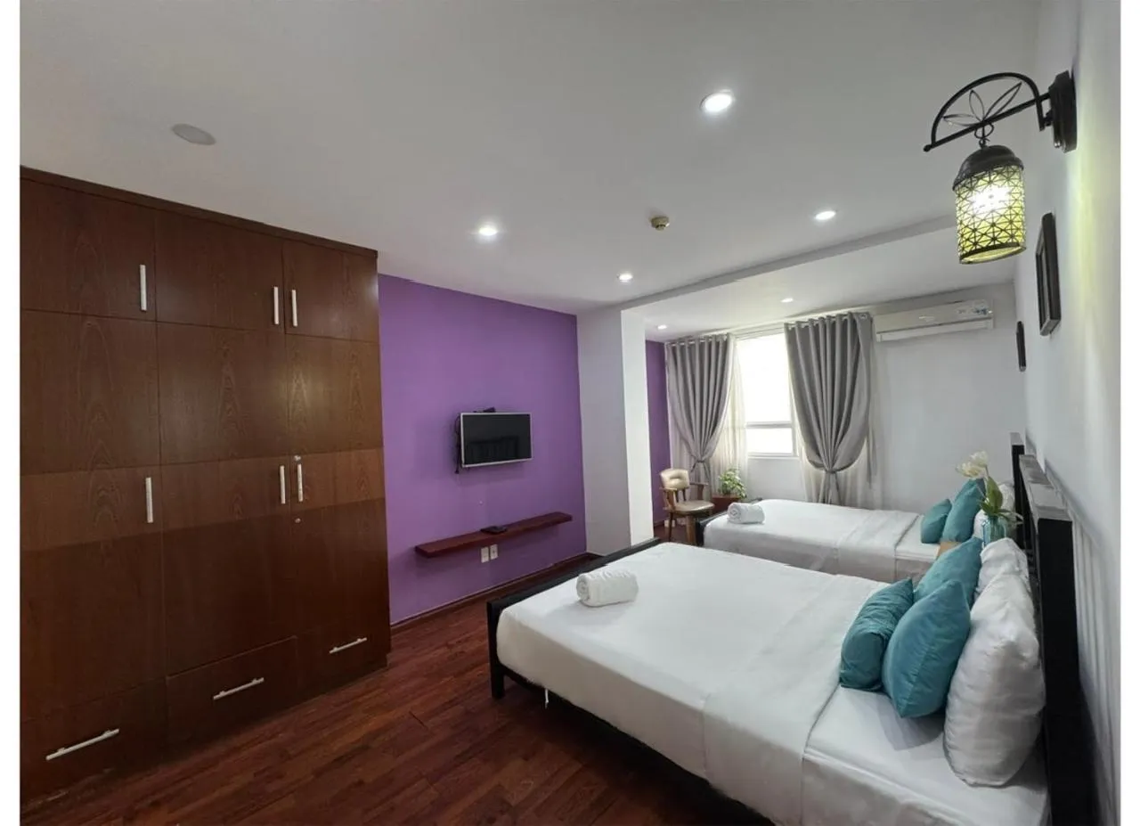 Bed in Chillax Apartment - Cozy 3-Bedroom City View Home at Tower, District 1