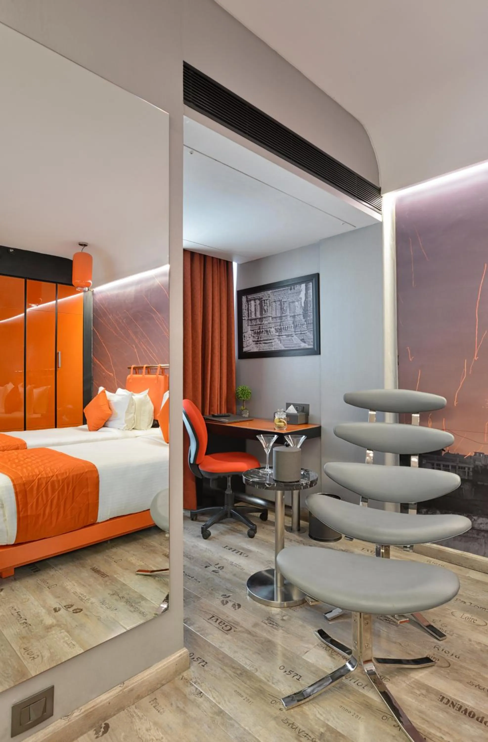 Seating area, Bed in Regenta Central Antarim Ahmedabad