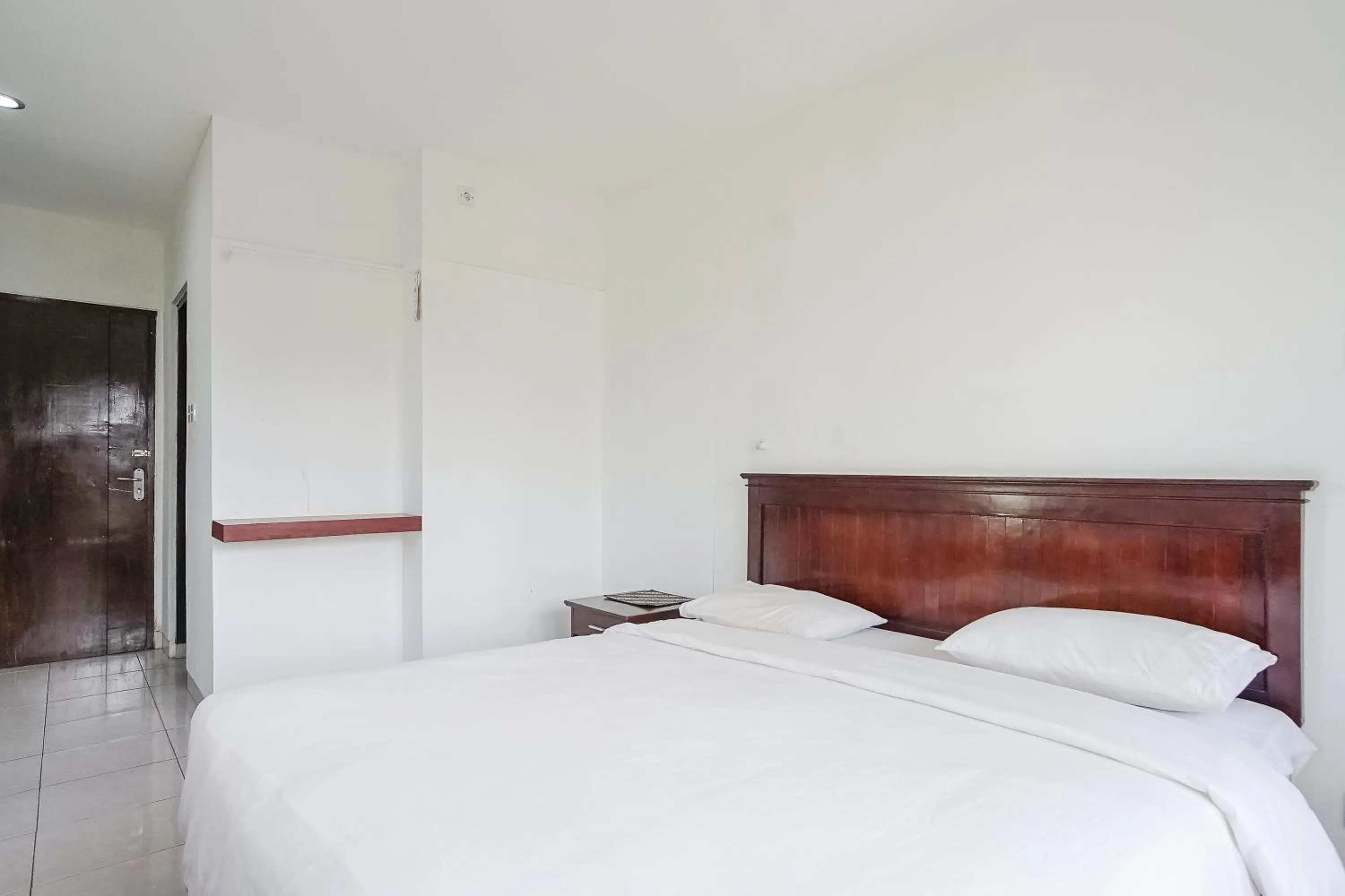 Bed in Indopurejoy House - Komala Indah Cottages