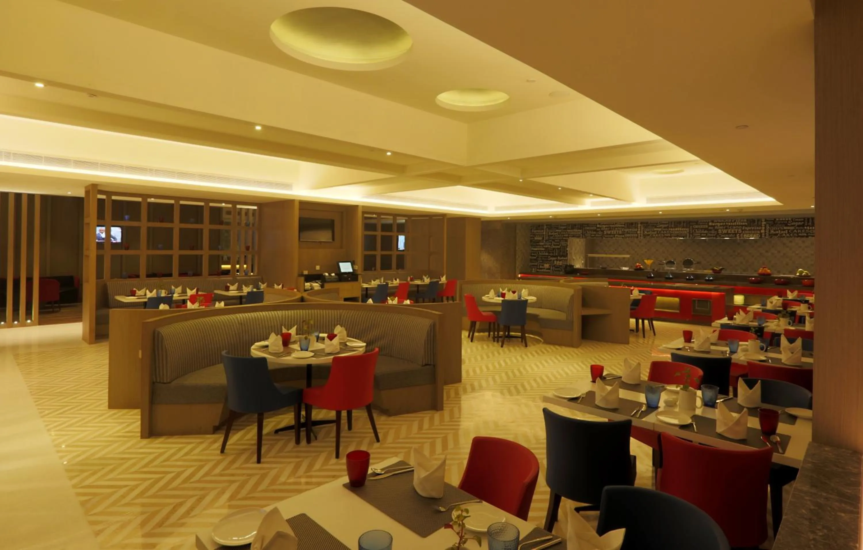 Dining area in Ramada by Wyndham Lucknow Hotel and Convention Center