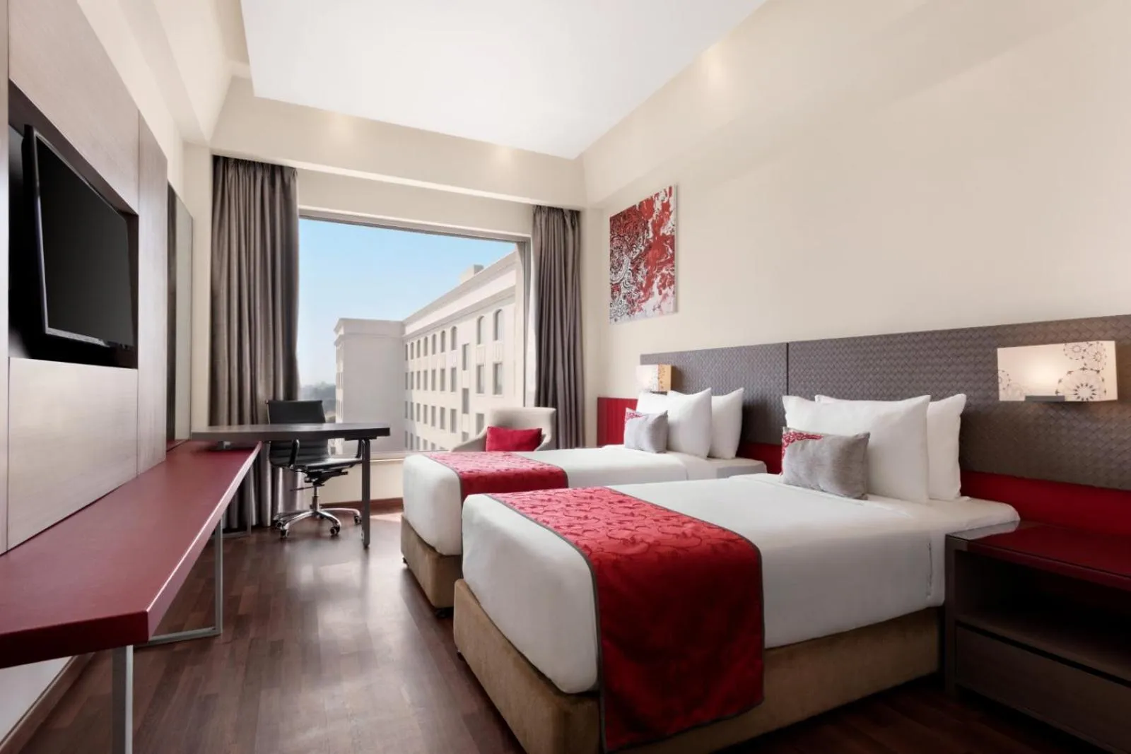 Bed in Ramada by Wyndham Lucknow Hotel and Convention Center