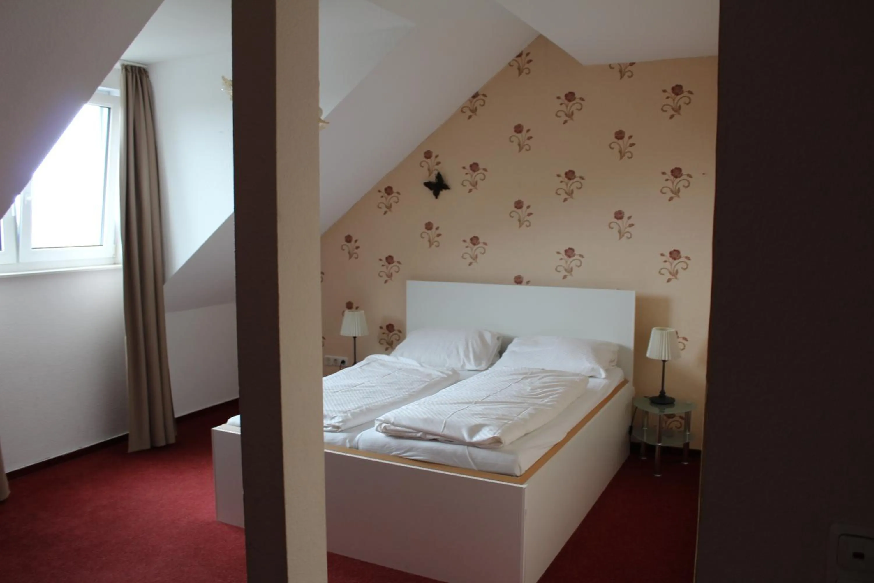 Bed in Hotel Gardenia