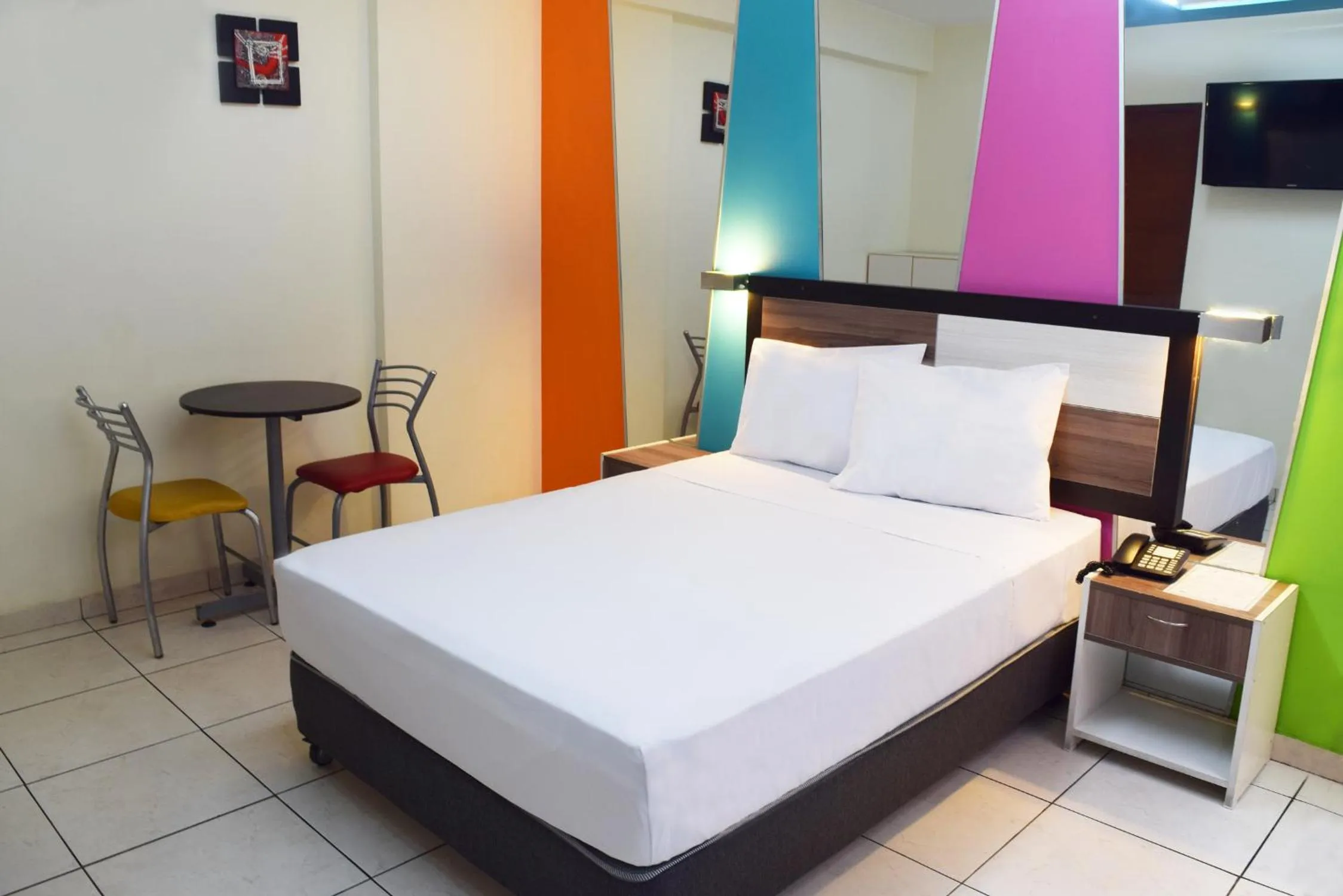 Bed in Hotel Colors Canada