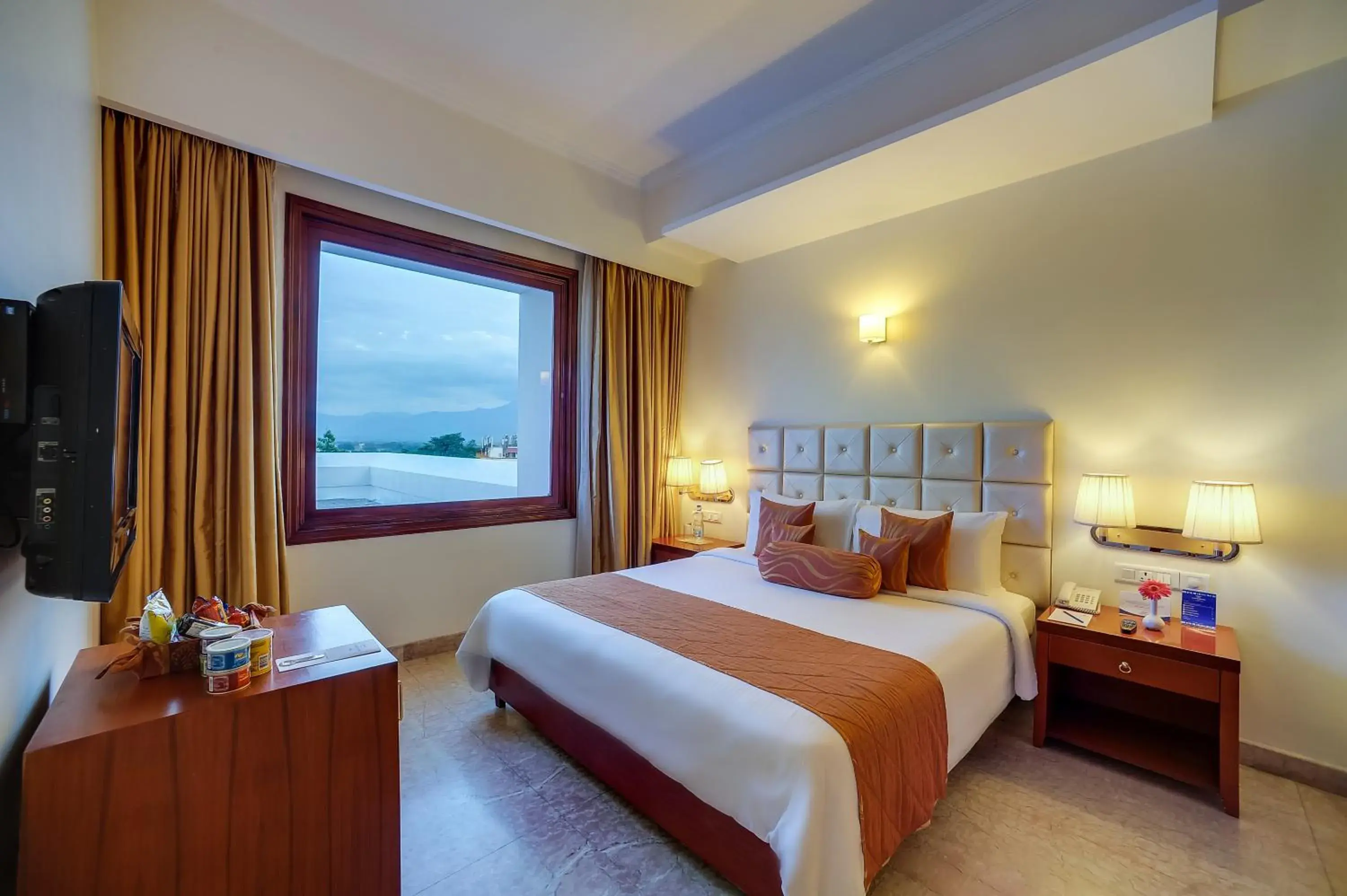 Suite Room - King Size Bed with Complimentary tea/coffee service for all our in-house guest at the poolside with some popular evening snacks of Siliguri from 5pm to 7pm in Royal Sarovar Portico Siliguri Suite Room - King Size Bed with Complimentary tea/coffee service for all our in-house guest at the poolside with some popular evening snacks of Siliguri from 5pm to 7pm in Royal Sarovar Portico Siliguri