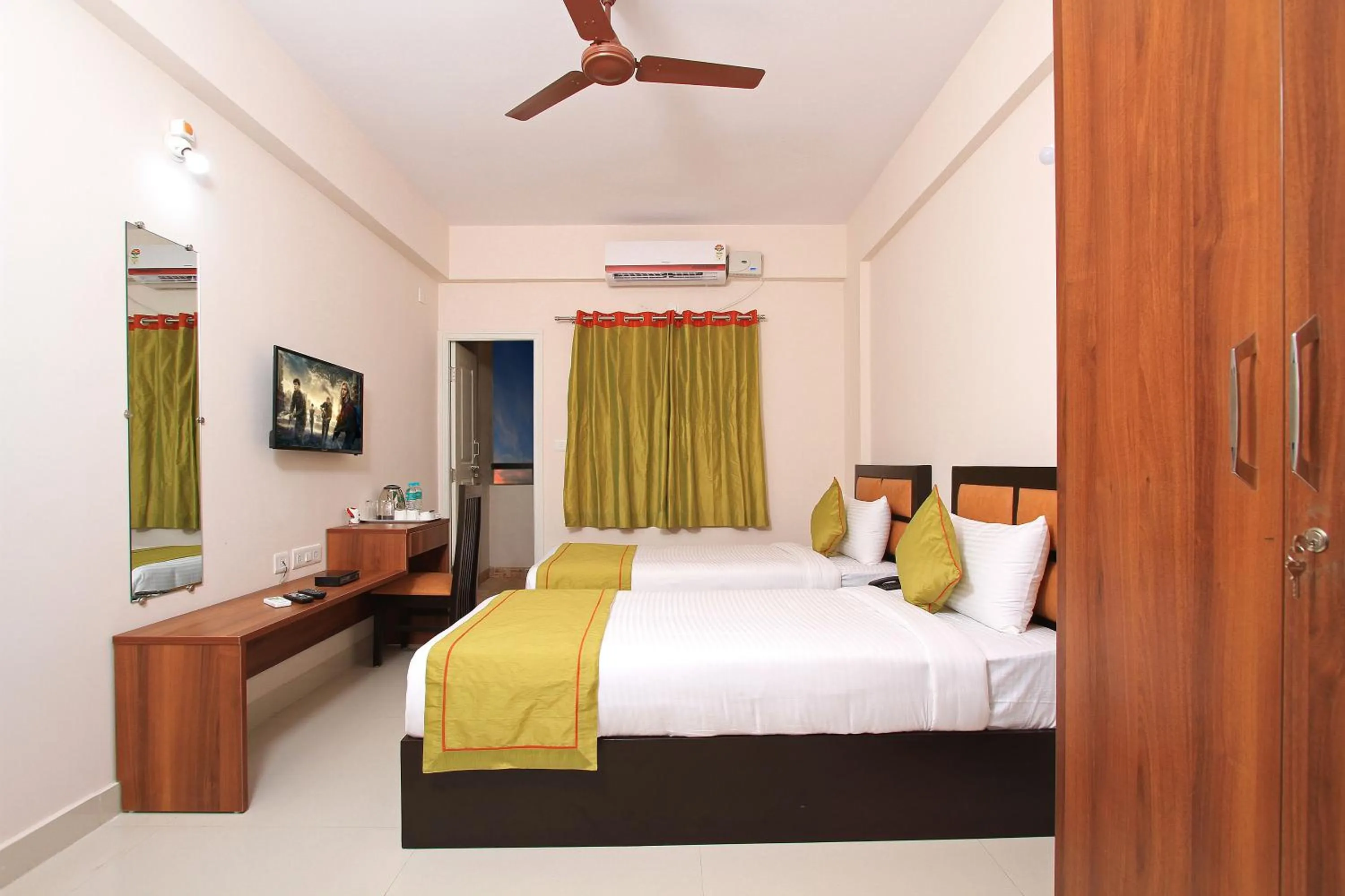 Bed in Arra Grande Suites Bangalore airport hotel