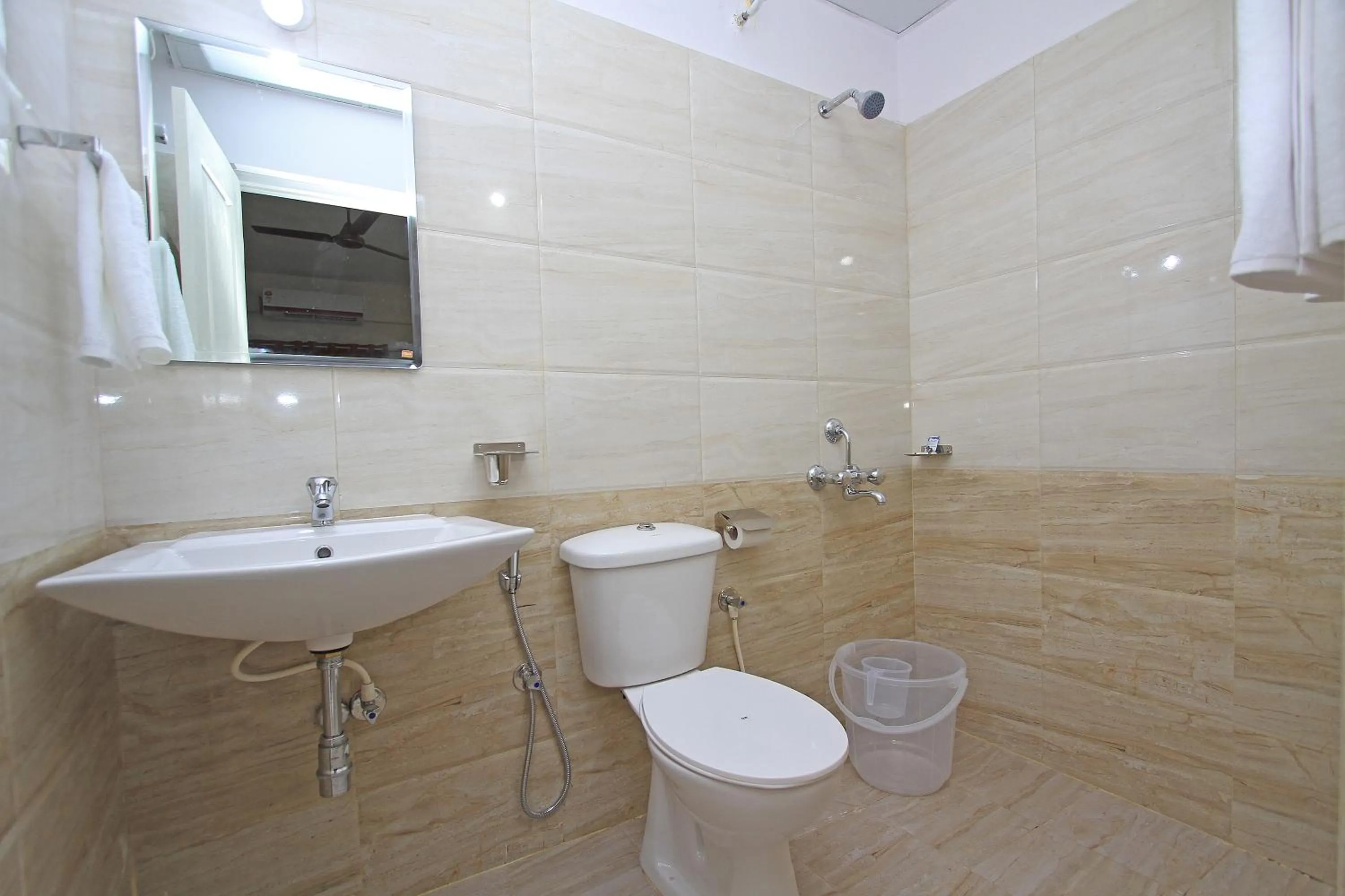 Bathroom in Arra Grande Suites Bangalore airport hotel