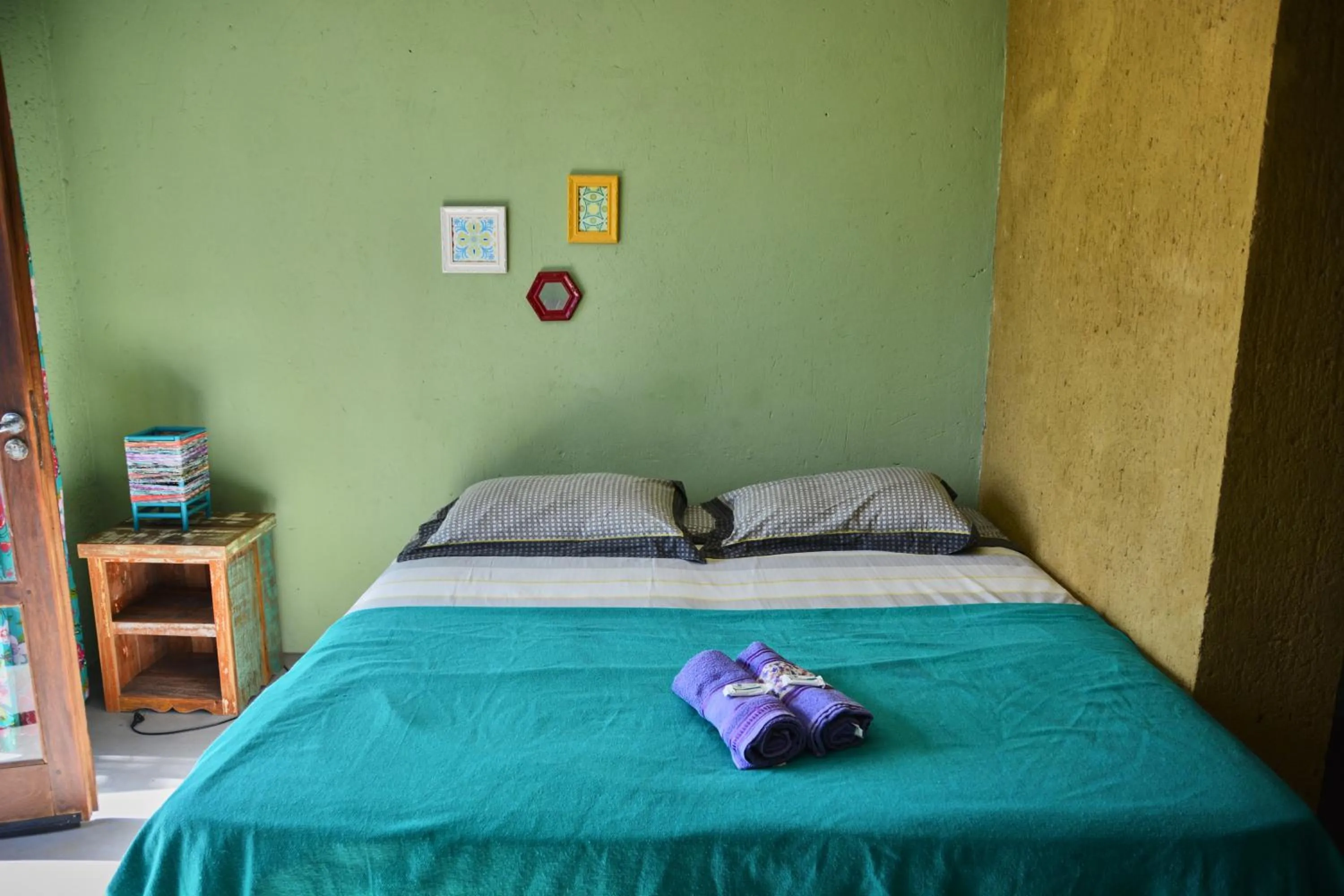 Bed in Pousada Alma da Gamboa