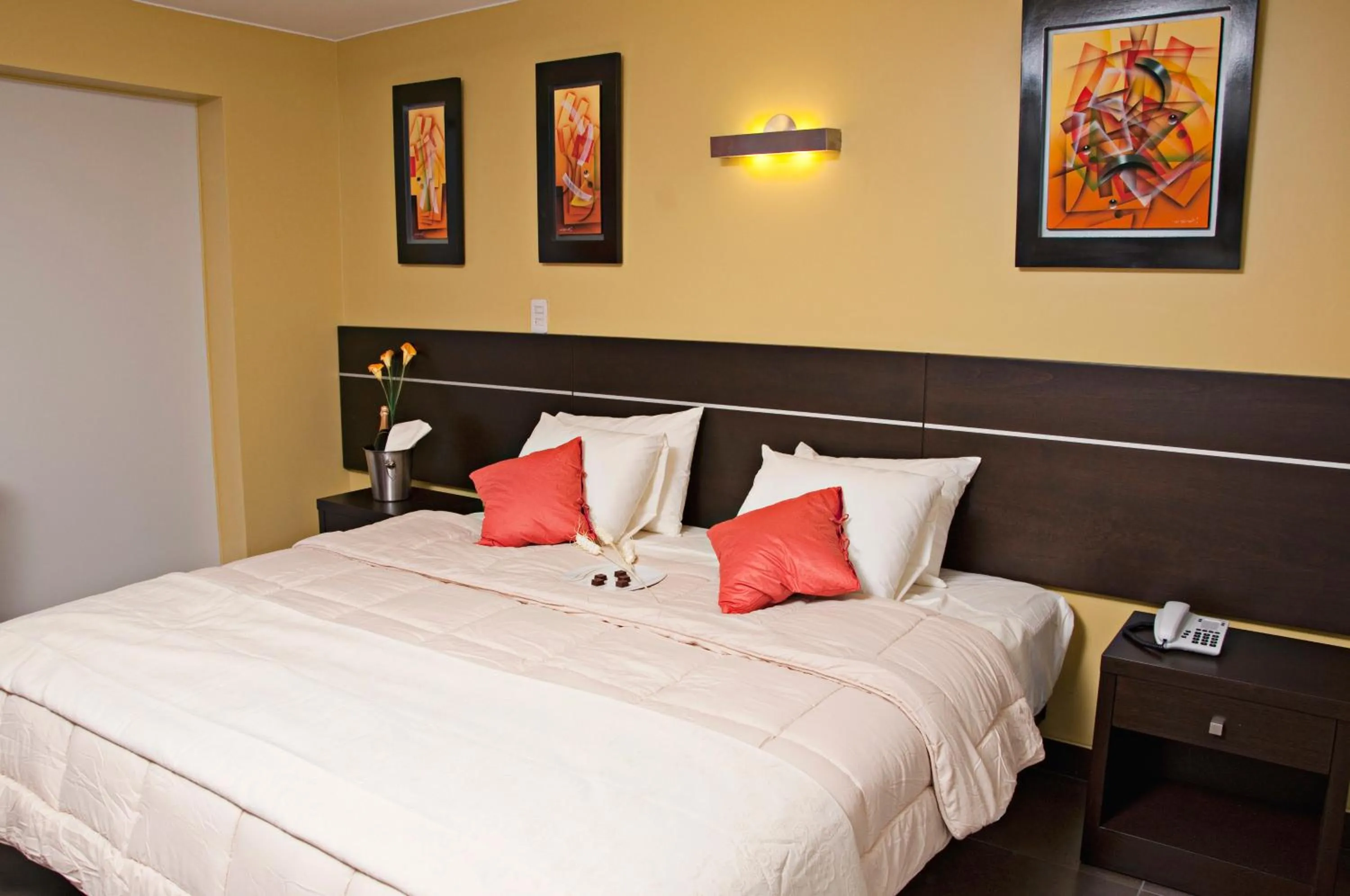 Bed in Flamante Hotel & Suite