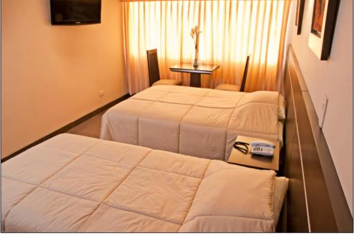 Bed in Flamante Hotel & Suite