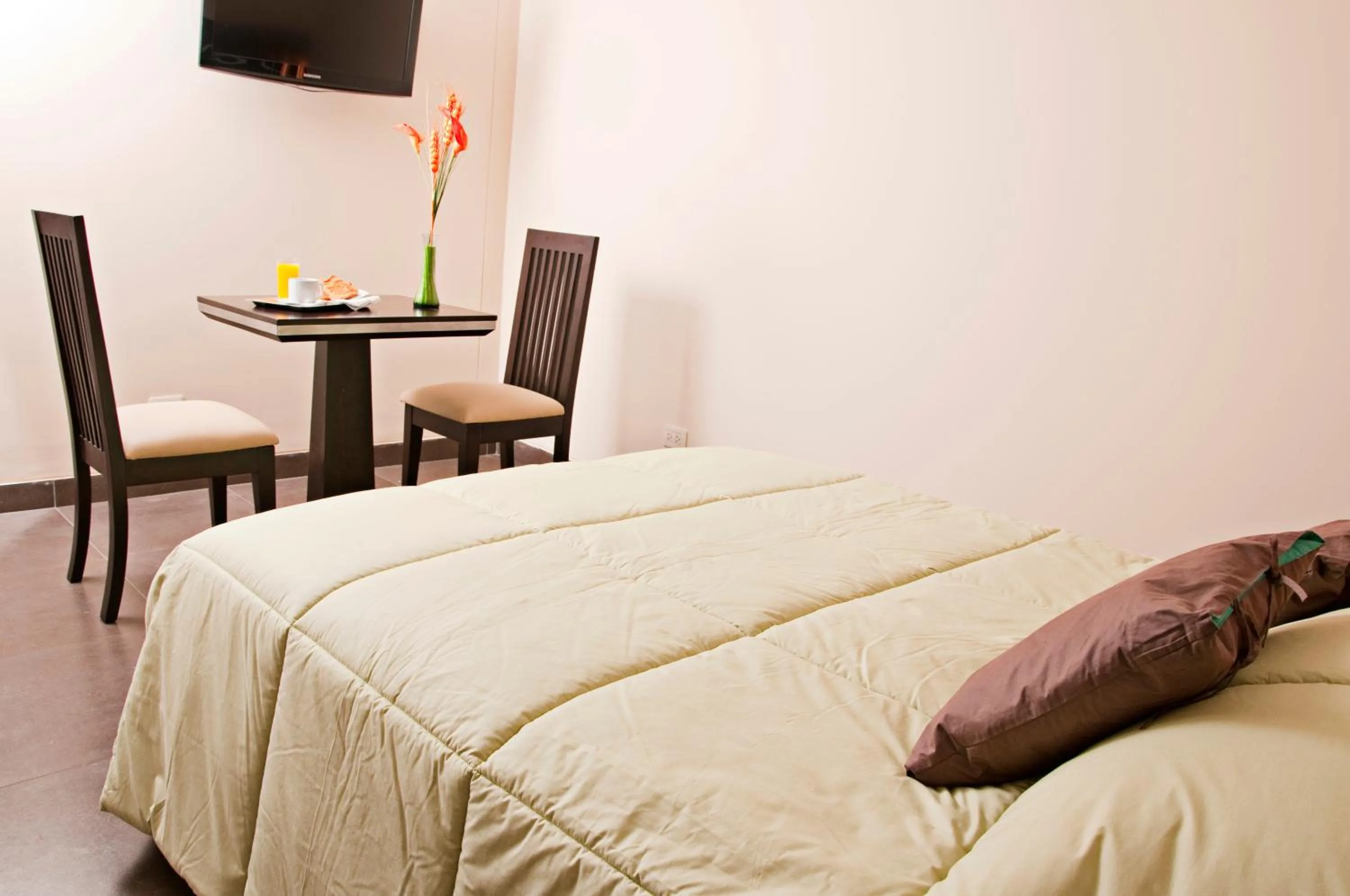 Bed in Flamante Hotel & Suite