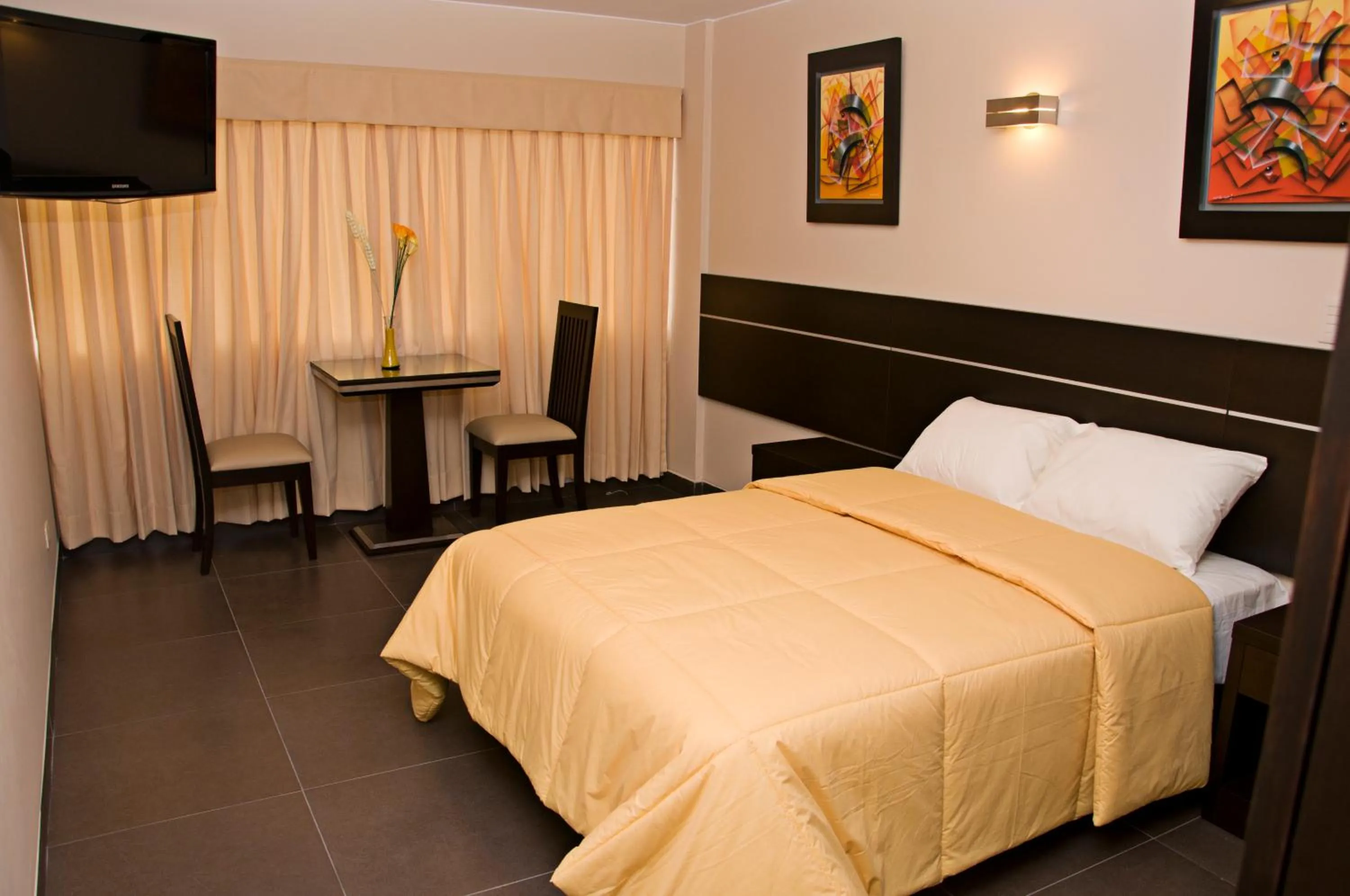 Bed in Flamante Hotel & Suite