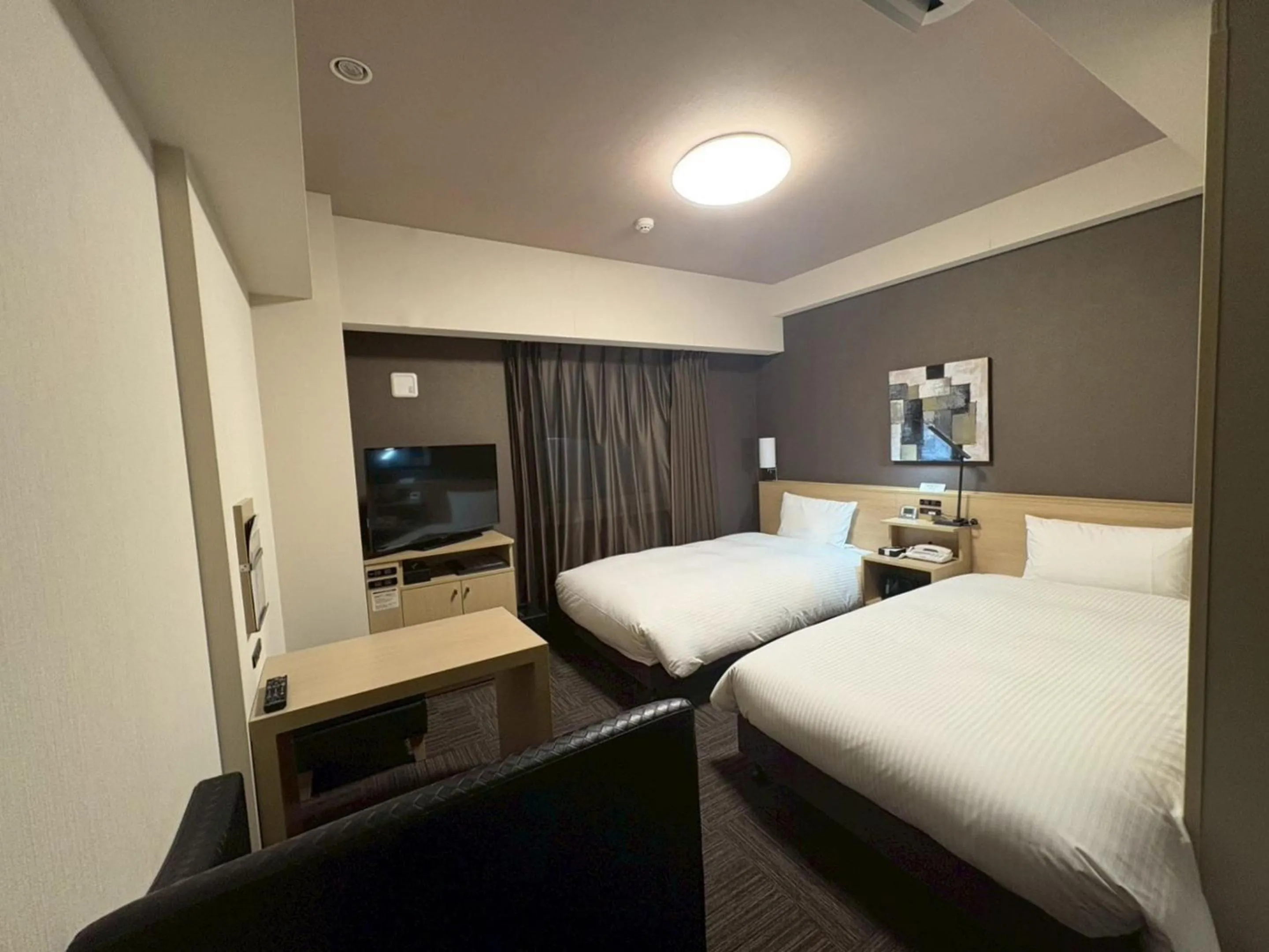 Photo of the whole room, Bed in Hotel Route-Inn Higashihiroshima Saijo Ekimae