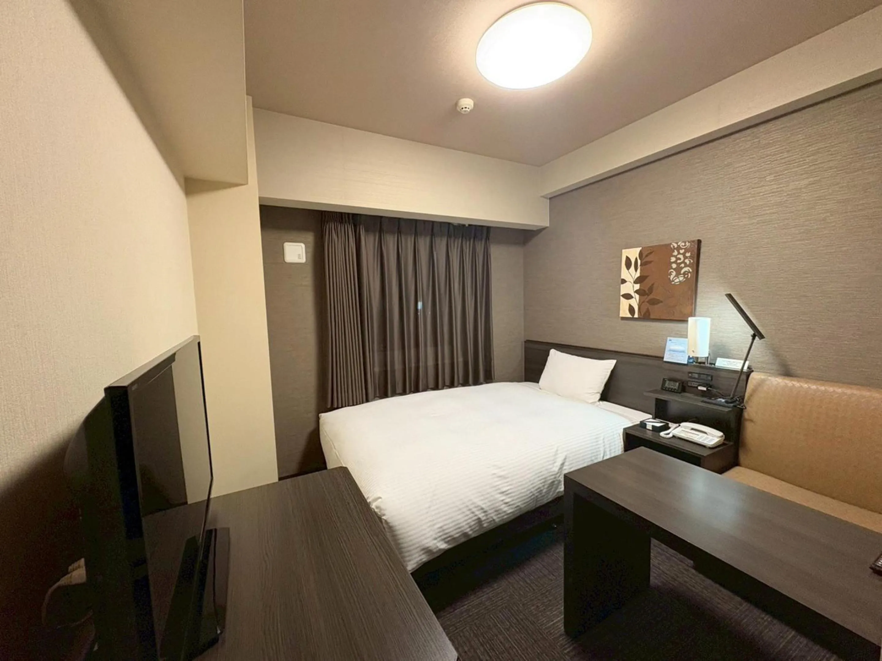 Photo of the whole room, Bed in Hotel Route-Inn Higashihiroshima Saijo Ekimae