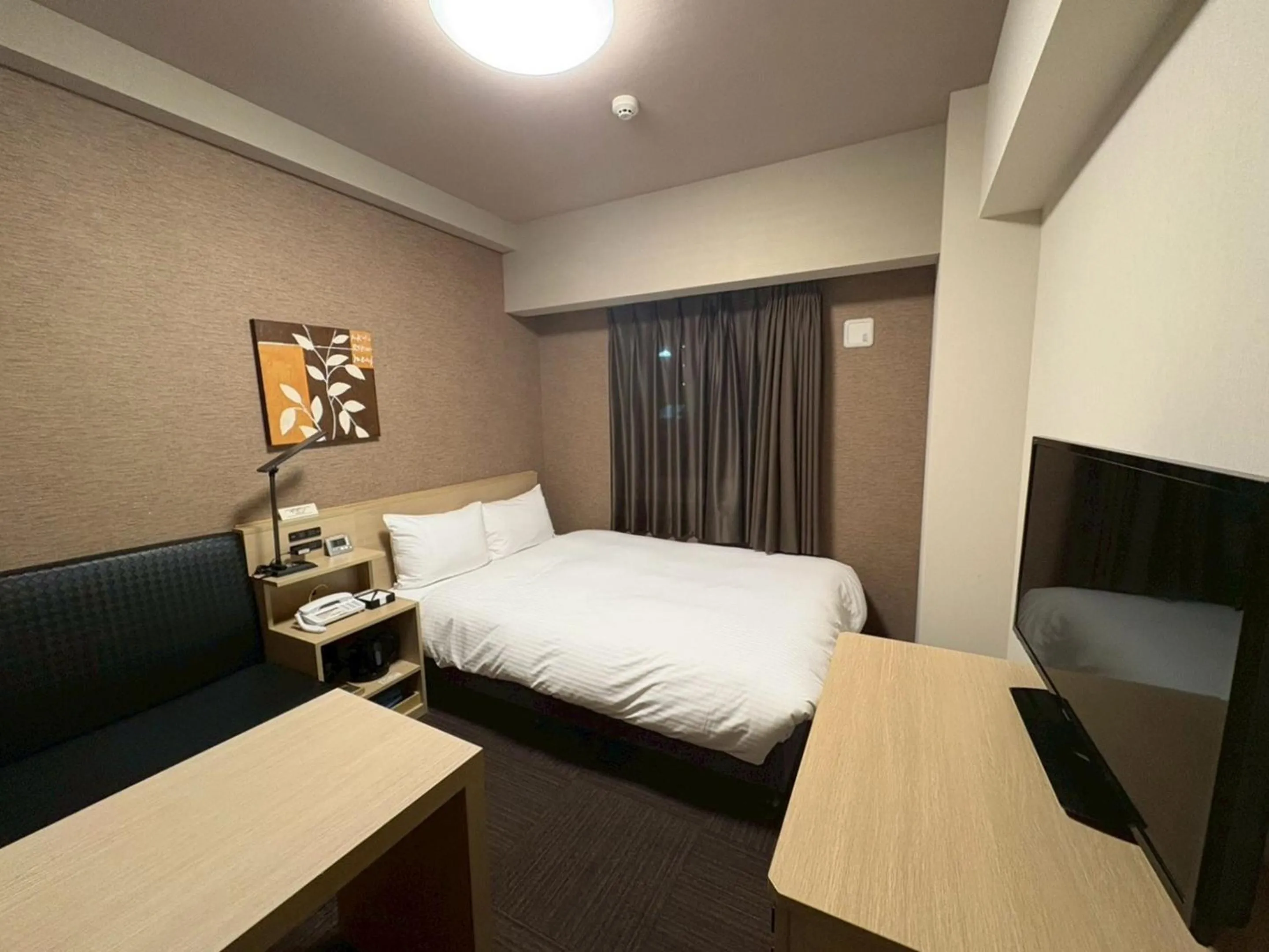 Photo of the whole room, Bed in Hotel Route-Inn Higashihiroshima Saijo Ekimae