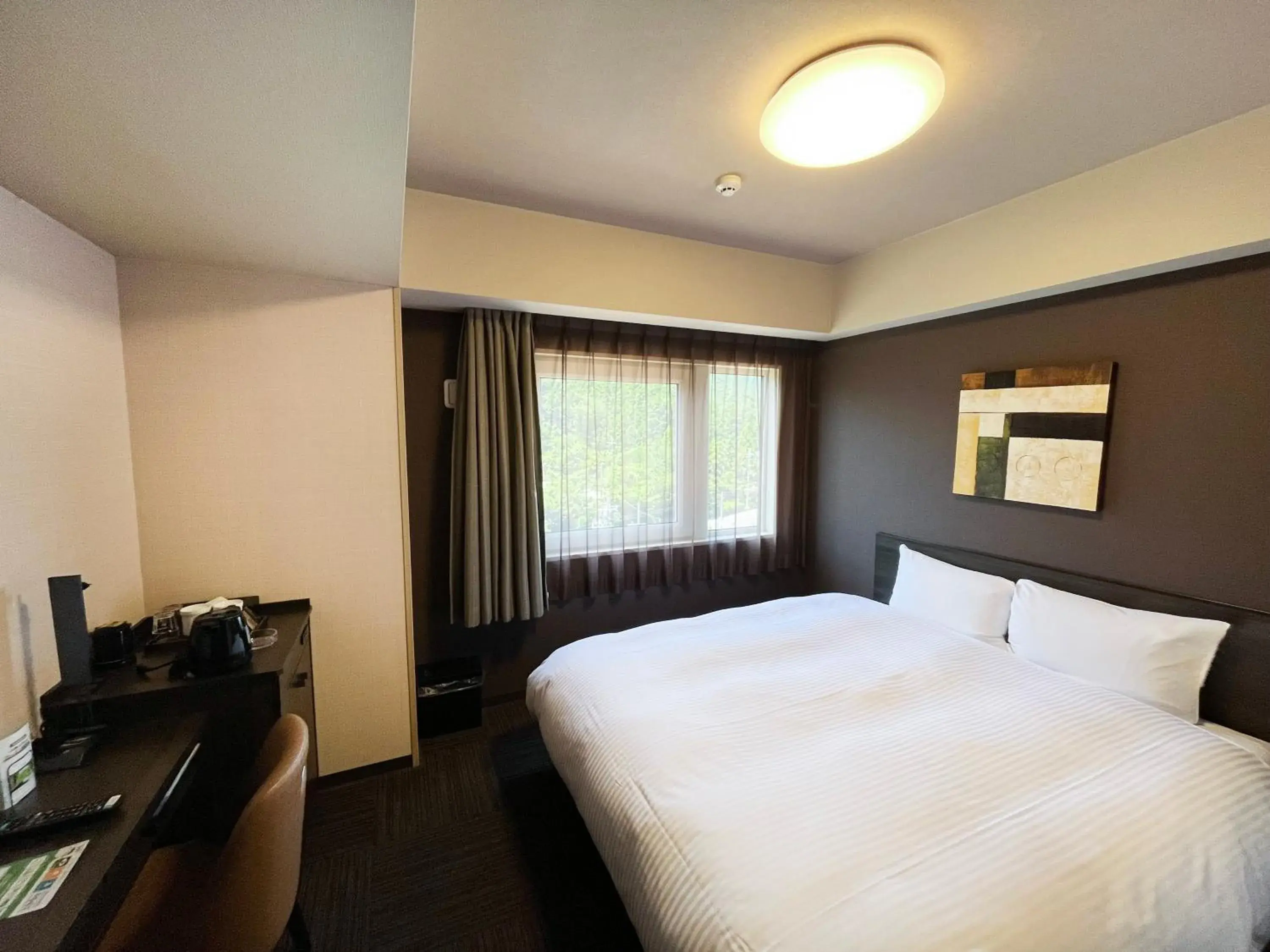 Bedroom, Bed in Hotel Route-Inn Higashiomi Yokaichi Ekimae Bedroom, Bed in Hotel Route-Inn Higashiomi Yokaichi Ekimae