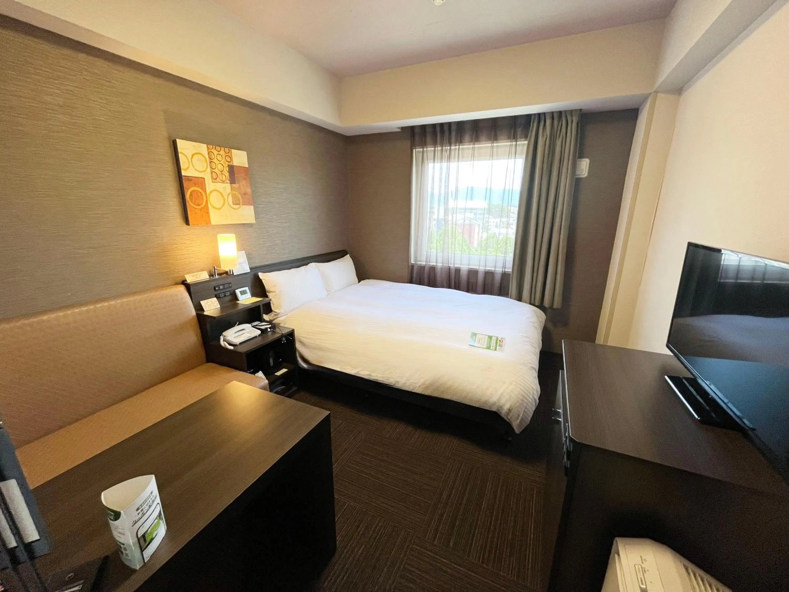 Bedroom, Bed in Hotel Route-Inn Higashiomi Yokaichi Ekimae