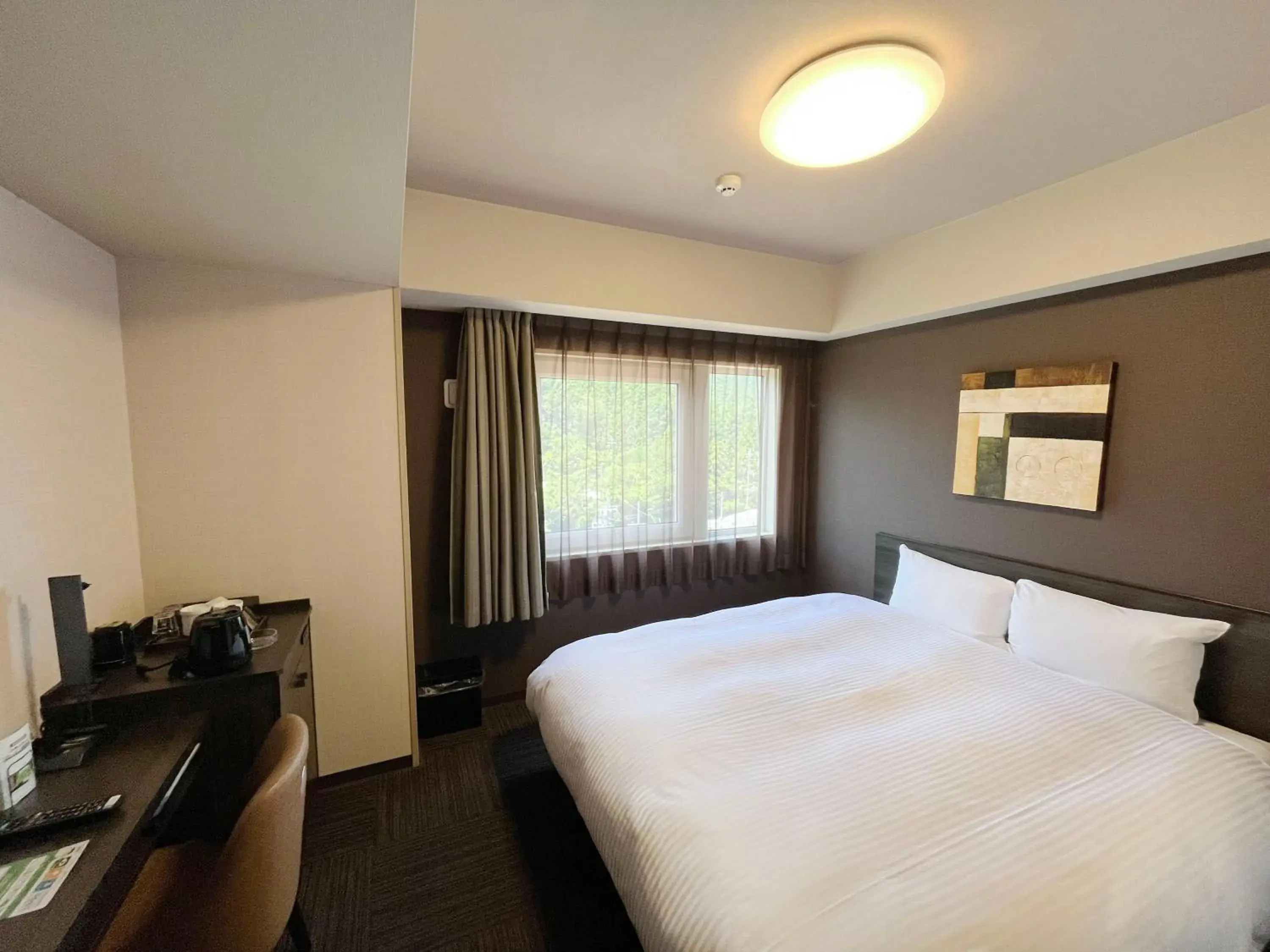 Bedroom, Bed in Hotel Route-Inn Higashiomi Yokaichi Ekimae Bedroom, Bed in Hotel Route-Inn Higashiomi Yokaichi Ekimae