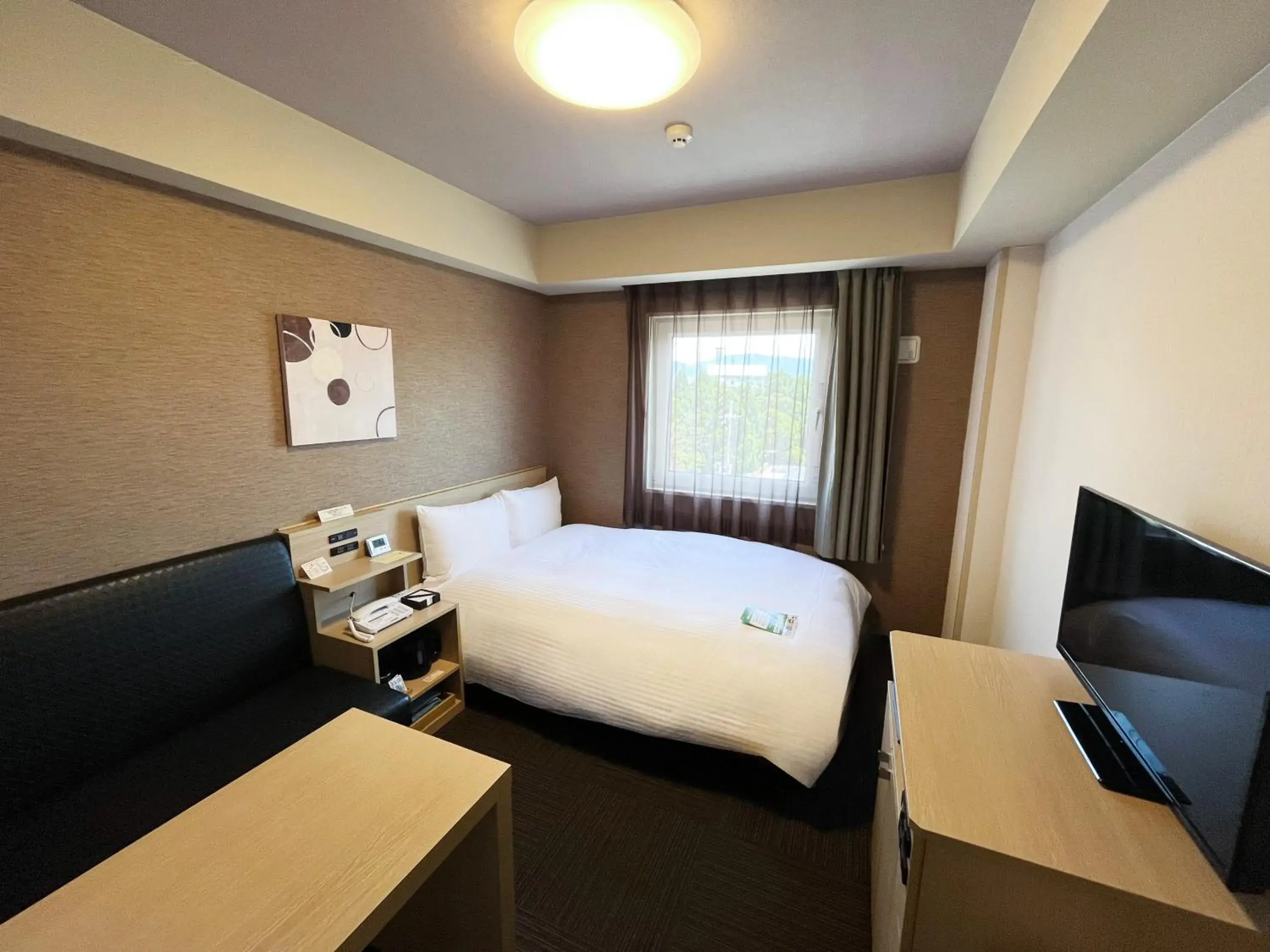 Bedroom, Bed in Hotel Route-Inn Higashiomi Yokaichi Ekimae Bedroom, Bed in Hotel Route-Inn Higashiomi Yokaichi Ekimae