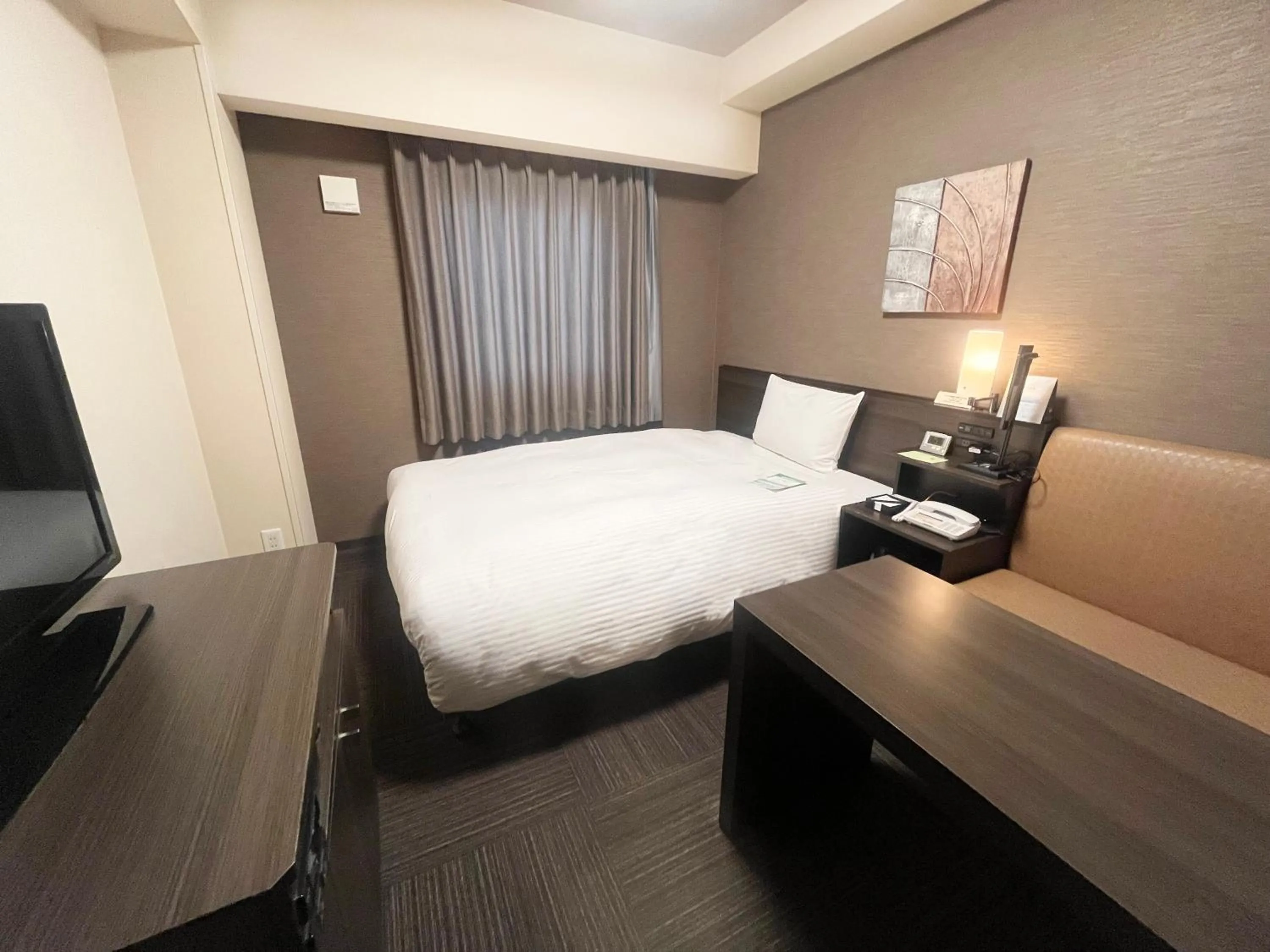 Photo of the whole room, Bed in ​Hotel Route-Inn Ube​