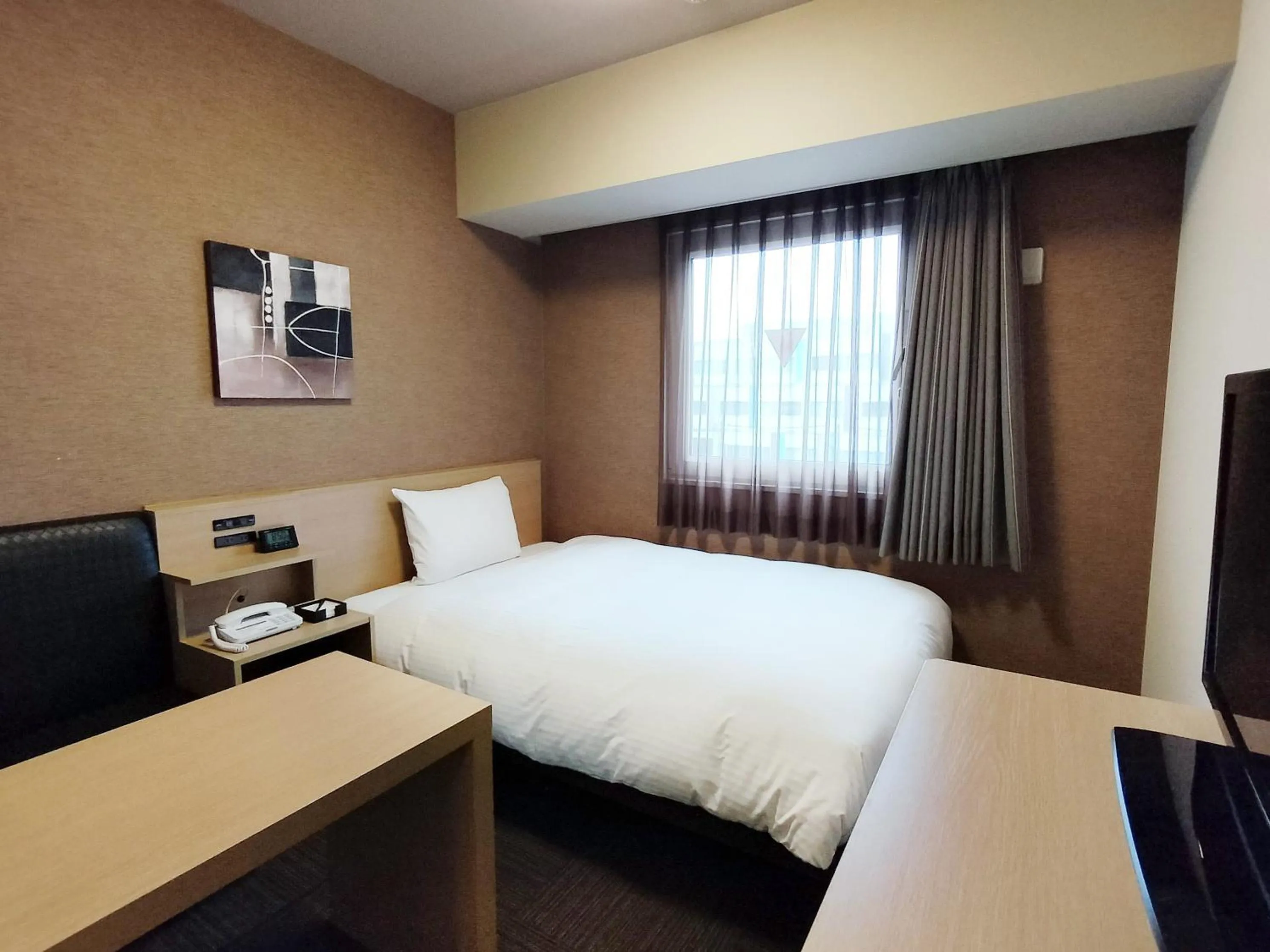 Photo of the whole room, Bed in Hotel Route-Inn Takaoka Ekimae
