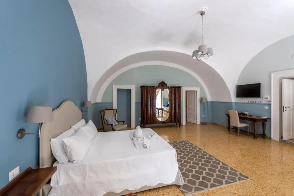 Bed in Aragonese Luxury Rooms