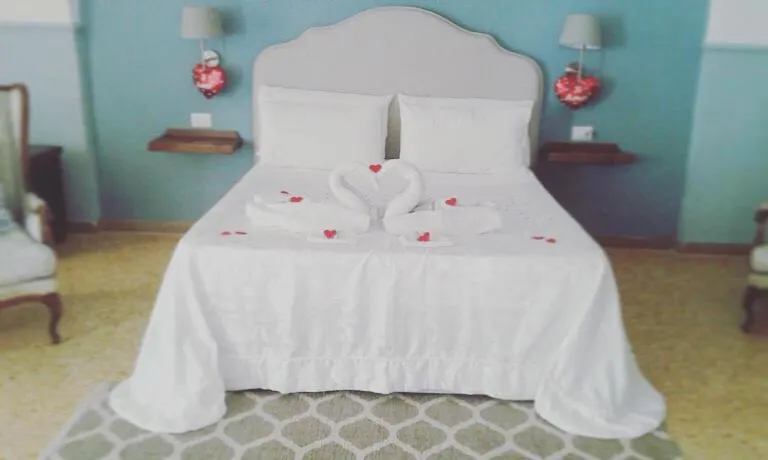 Bed in Aragonese Luxury Rooms