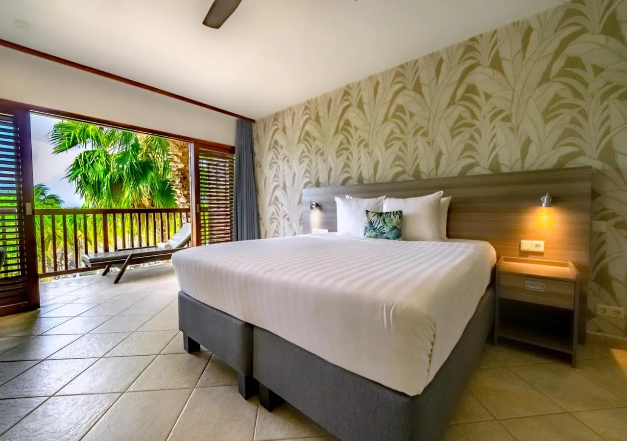 Bed in LionsDive Beach Resort