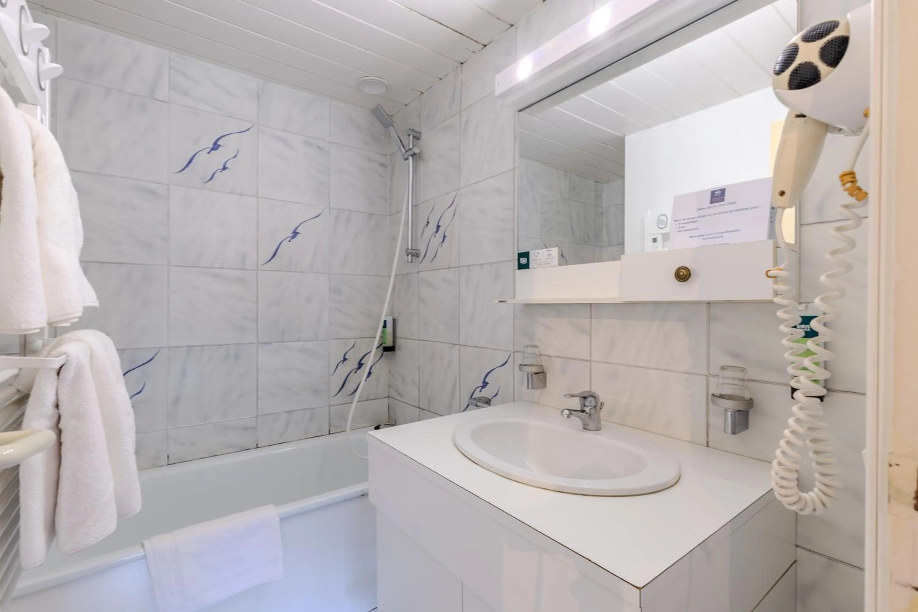 Bathroom in Logis Hôtel Le Manoir Des Portes