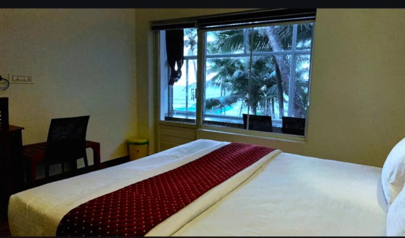 Bed in White Shell Beach House