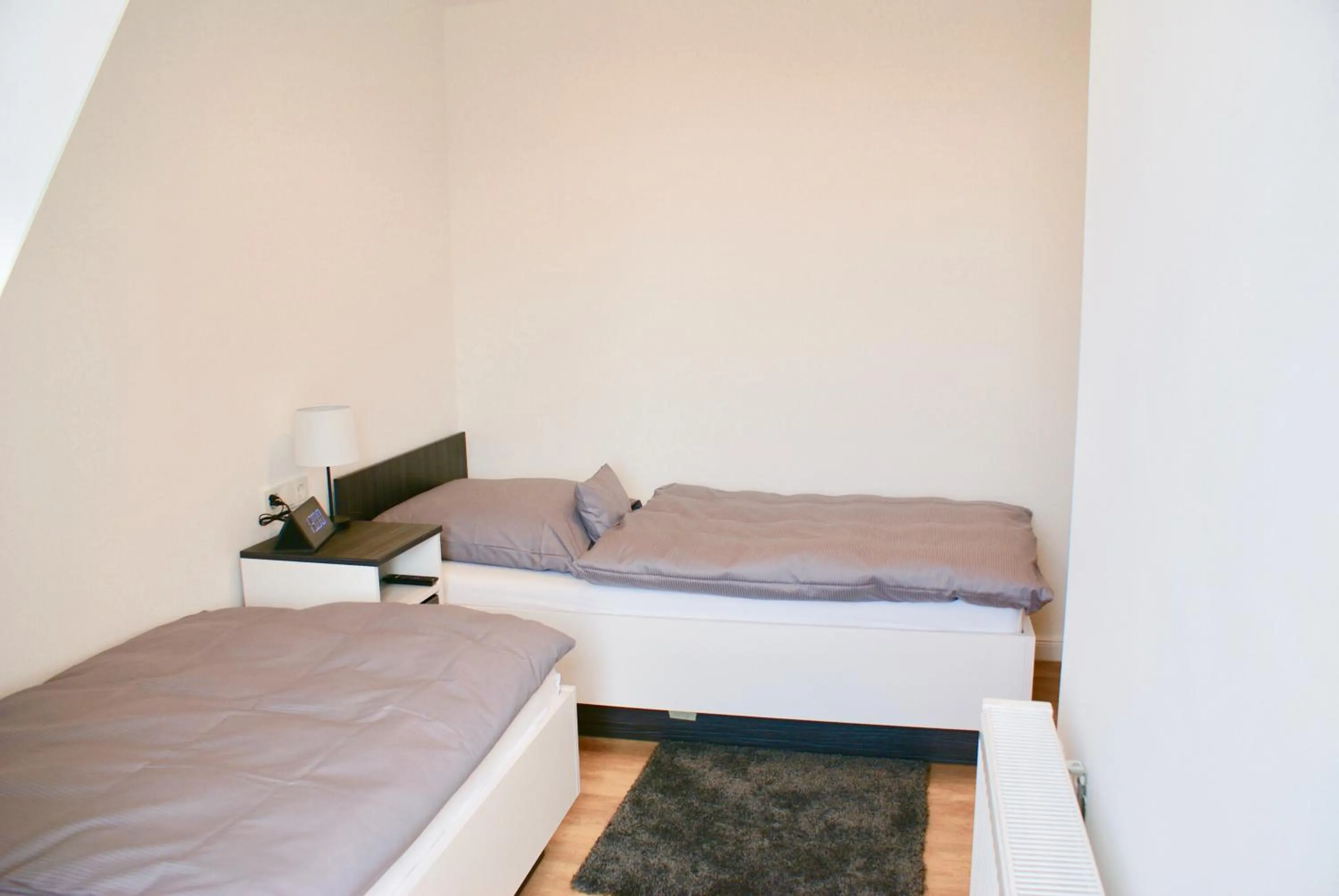 Photo of the whole room, Bed in Deichhotel Rose