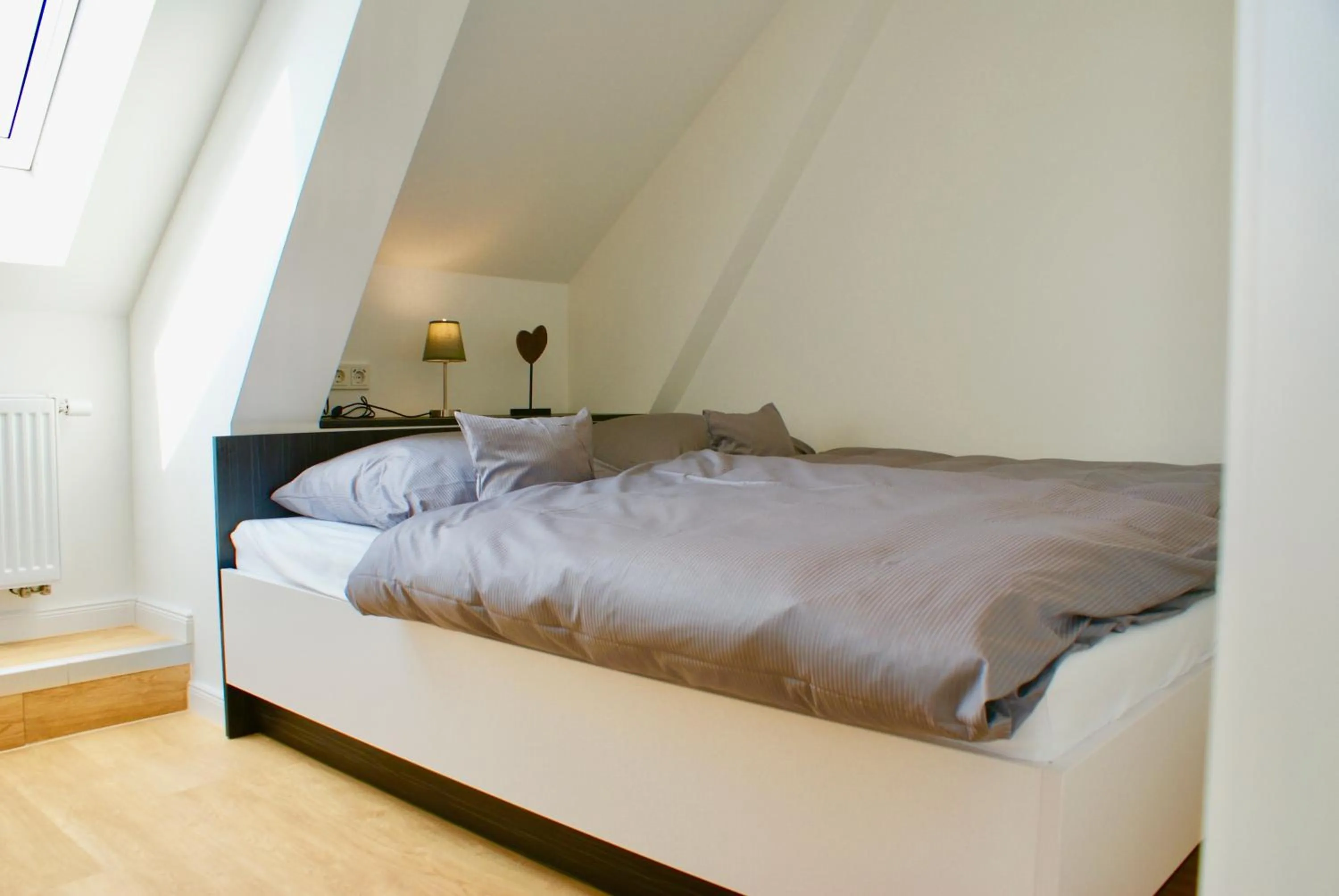 Photo of the whole room, Bed in Deichhotel Rose