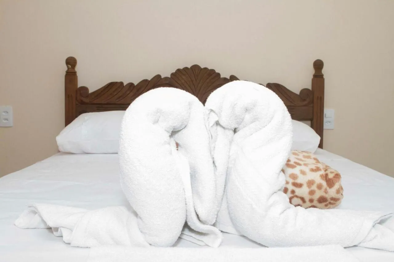 Bed in Pousada Irmãos da Serra