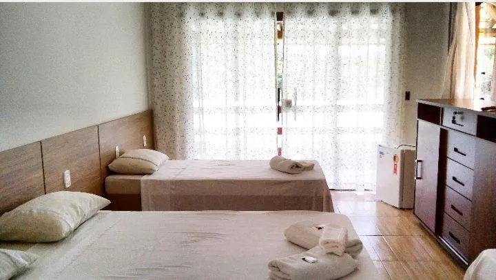 Bed in Pousada Irmãos da Serra