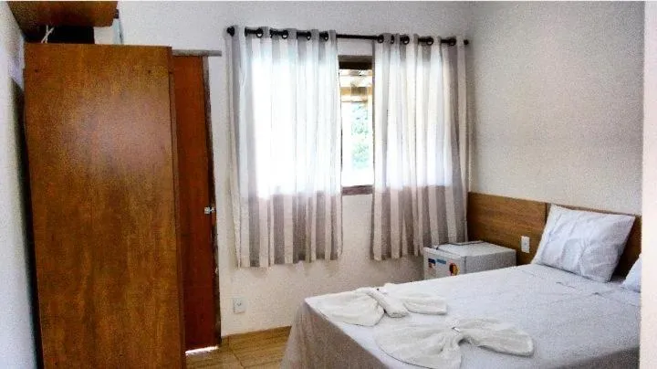 Bed in Pousada Irmãos da Serra