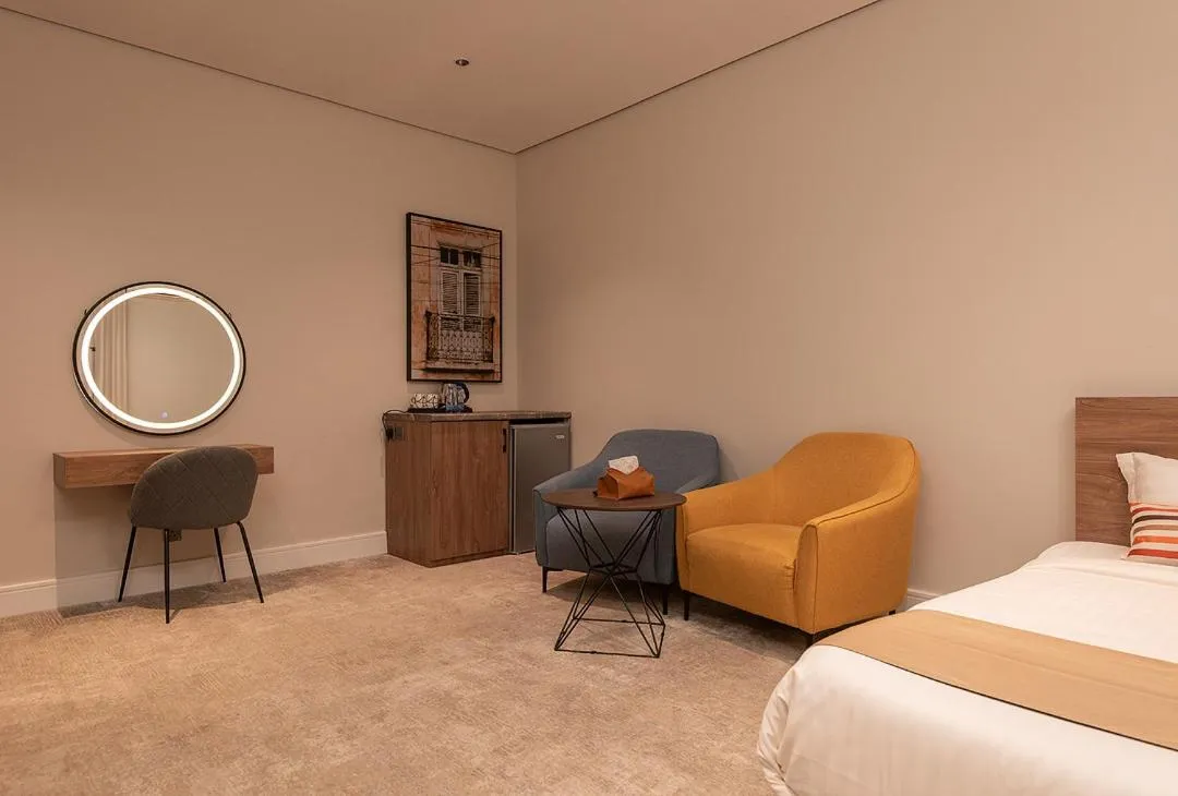 Seating area, Bed in Viola Gardens Residence Serviced apartments