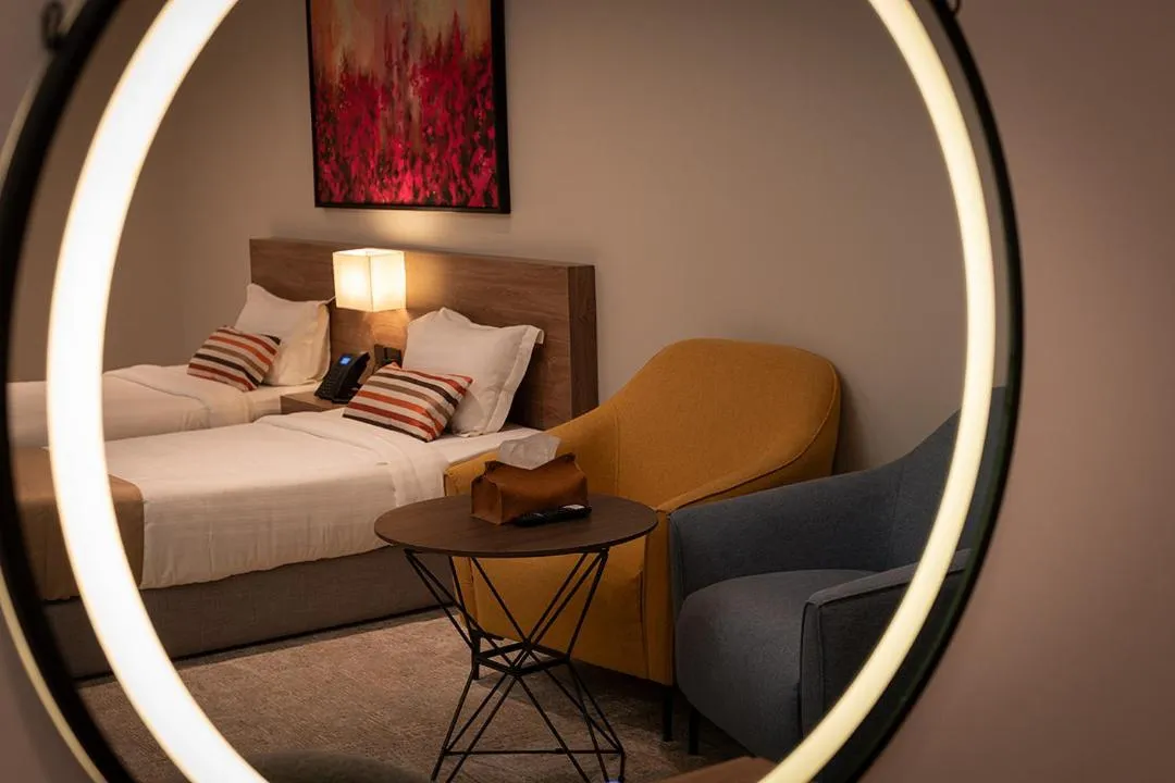 Seating area, Bed in Viola Gardens Residence Serviced apartments