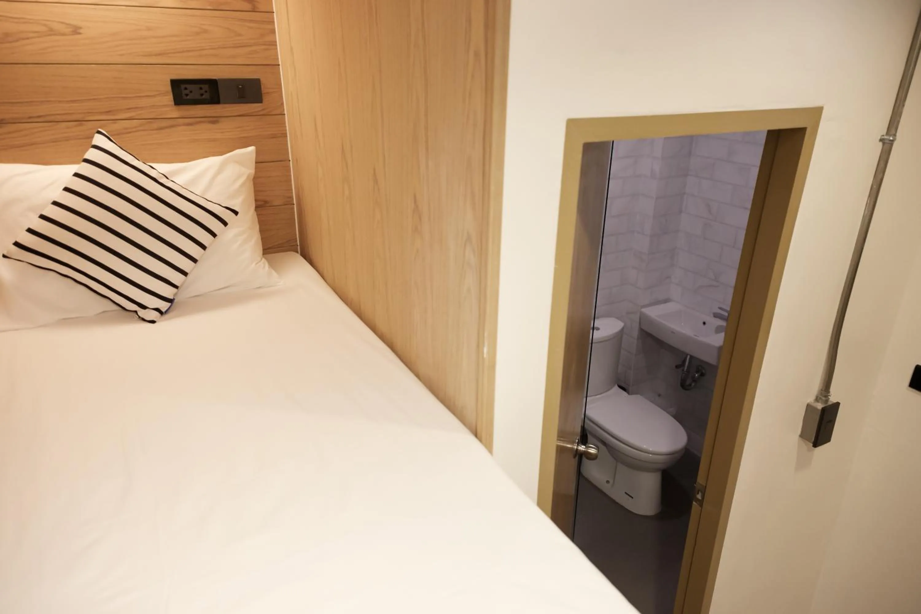 Bed in Vann Bangkok Boutique House