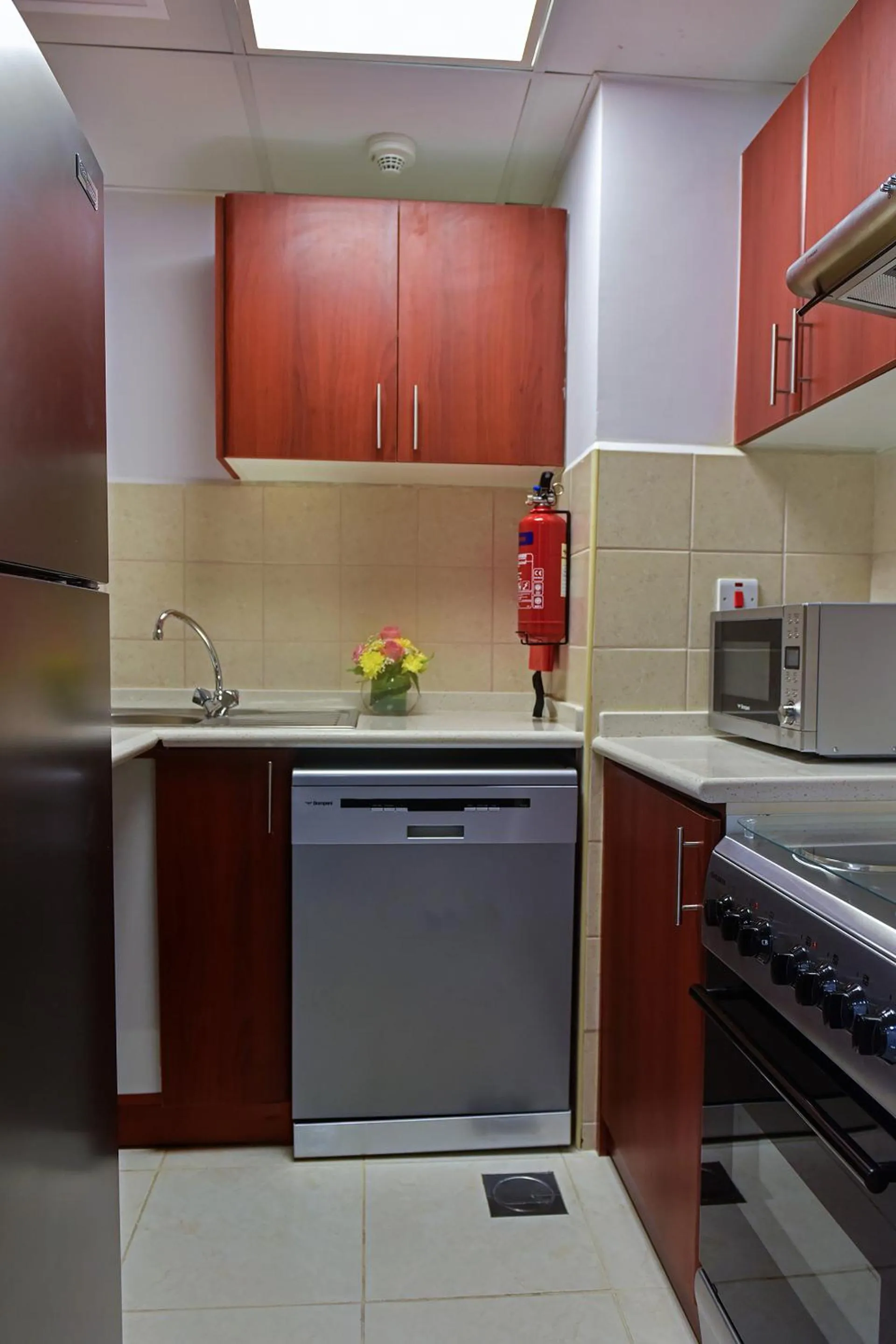 Kitchen or kitchenette in Jannah Hotel Apartments & Villas