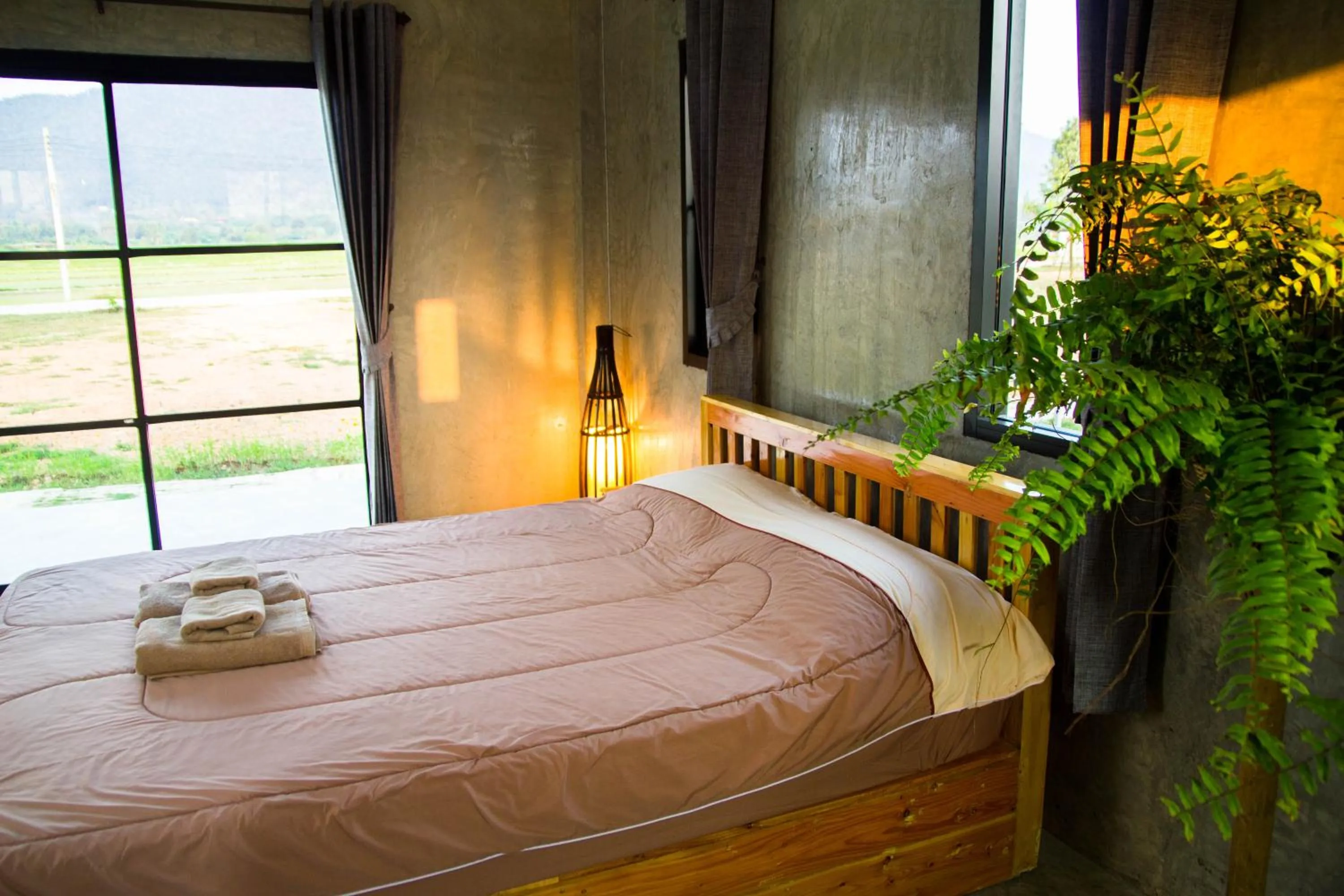 Photo of the whole room, Bed in Santitham Home Farm Stay