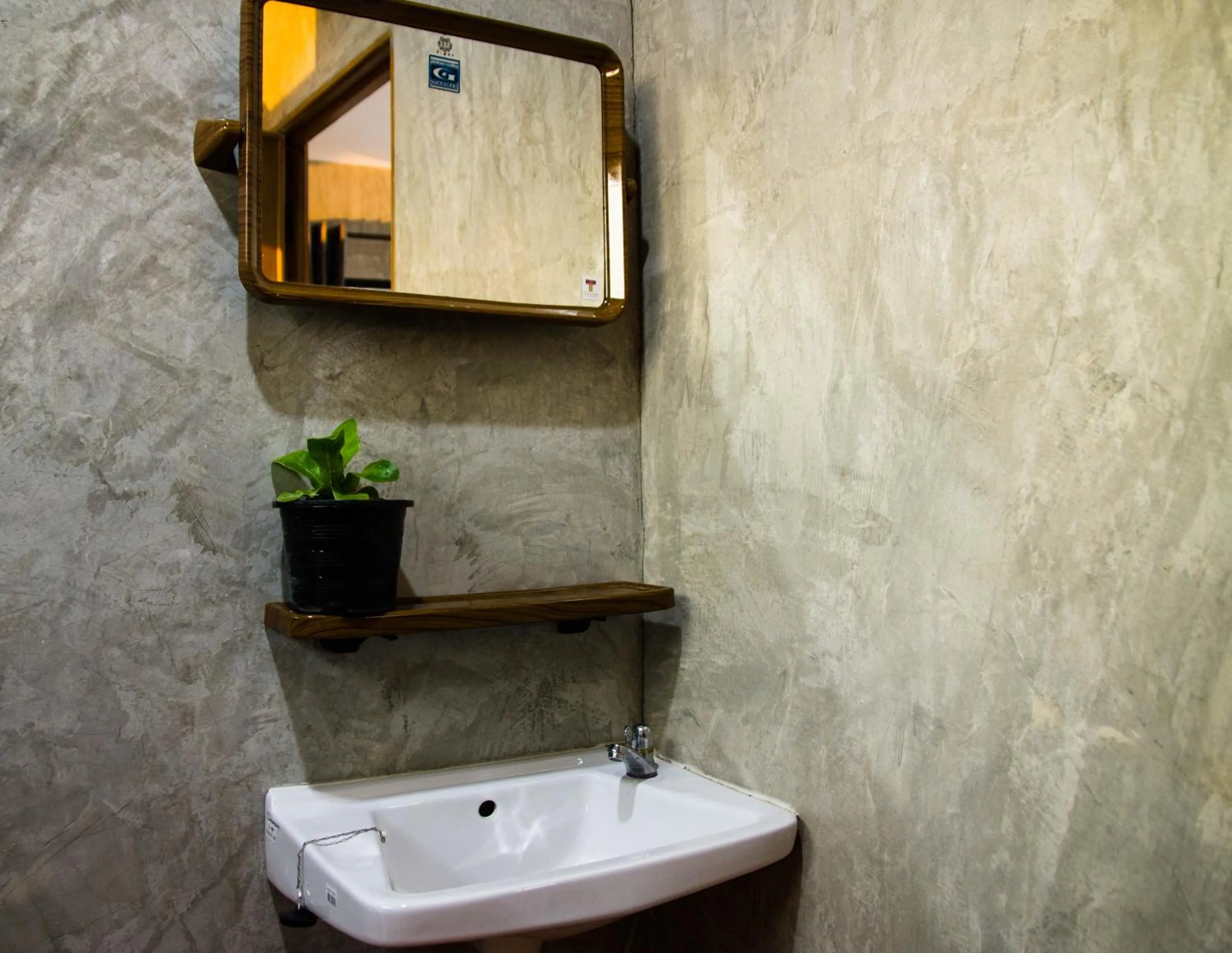 Photo of the whole room in Santitham Home Farm Stay