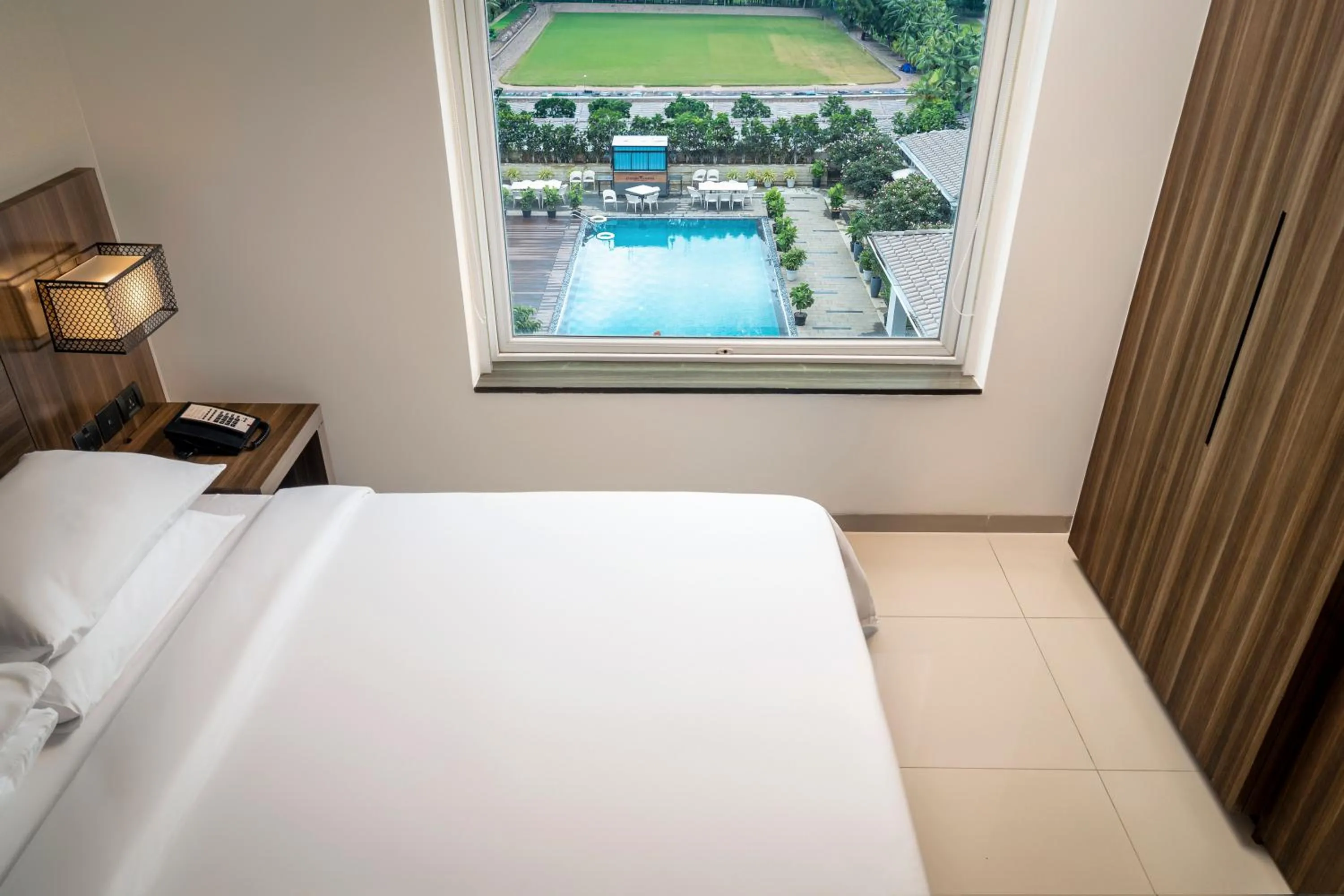 Pool view, Bed in The Residency Towers, Rameswaram