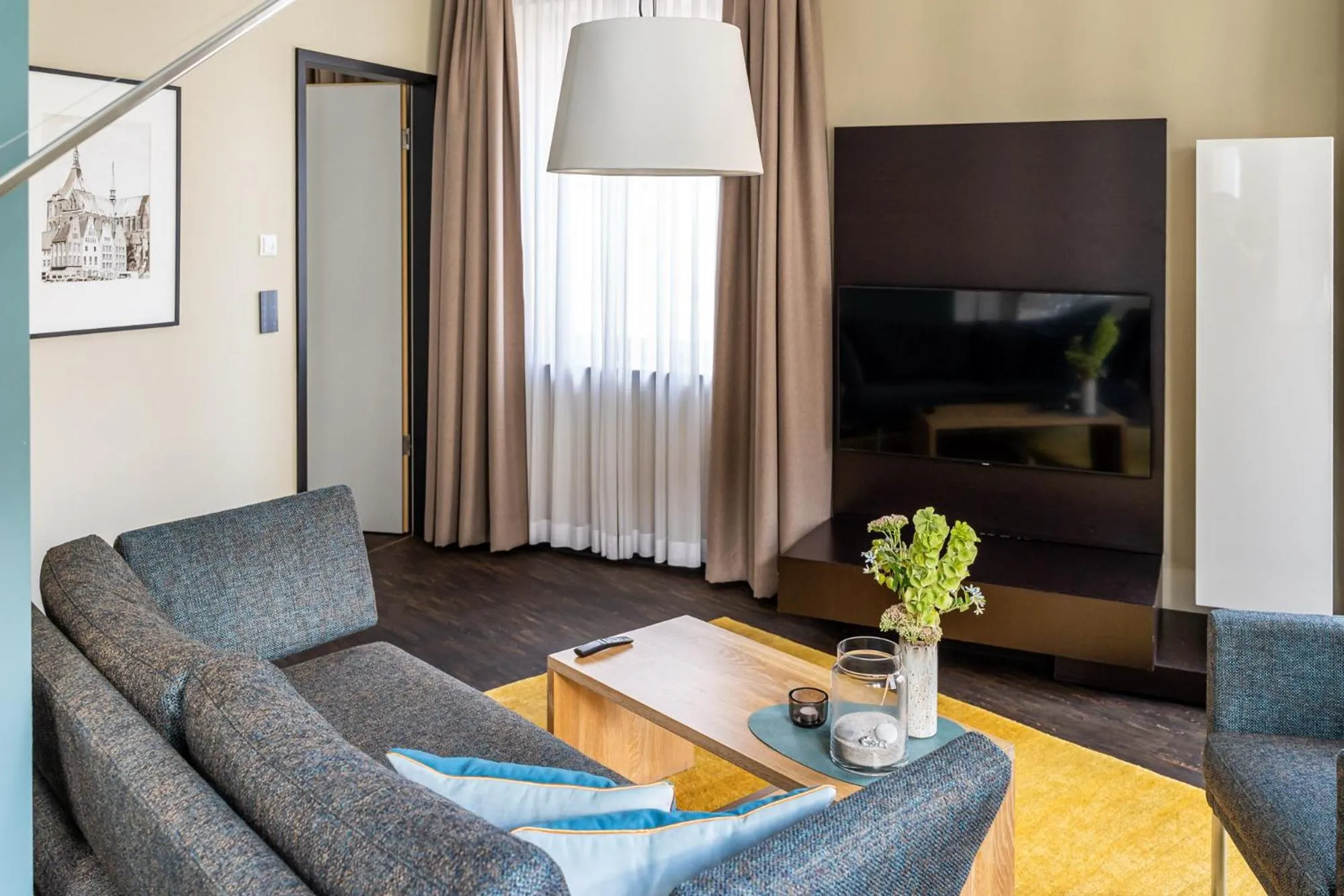 TV and multimedia in The Green Rostock Apartment Hotel