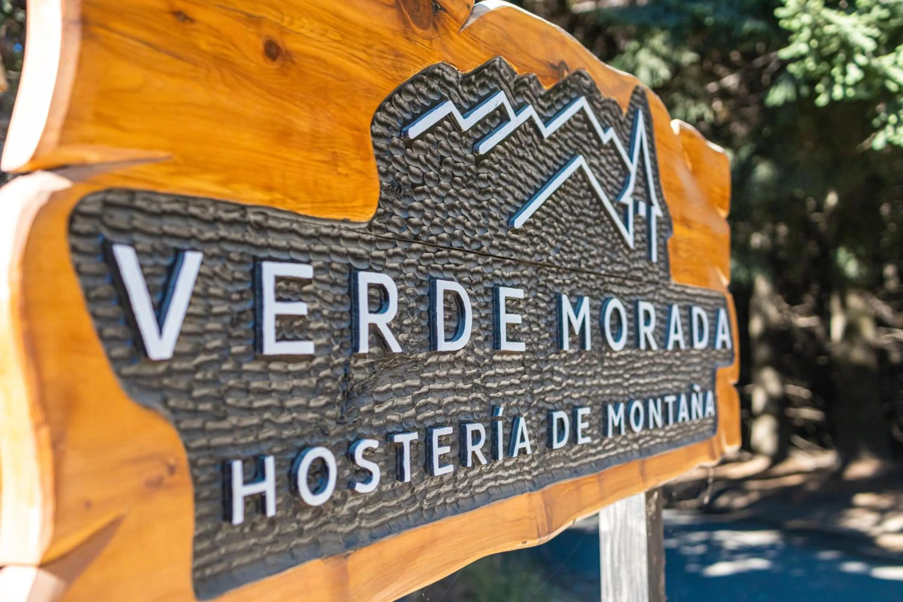 Property logo or sign in Hostería Verde Morada