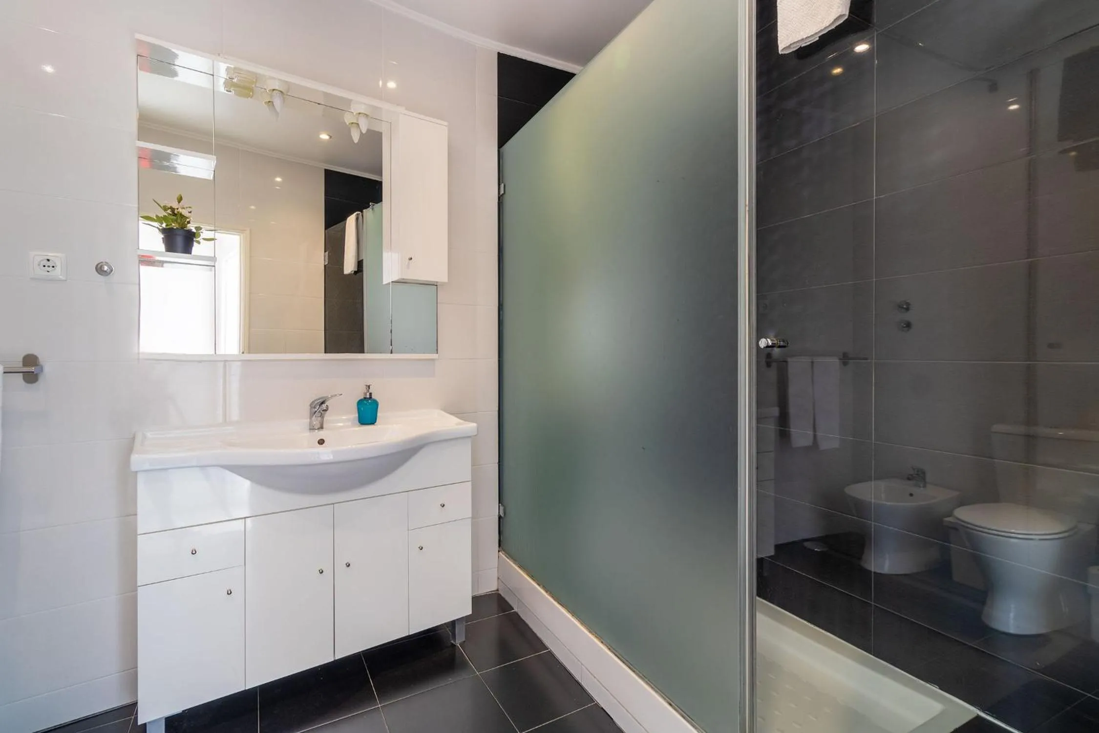 Bathroom in Diario de Noticias by Central Hill Apartments