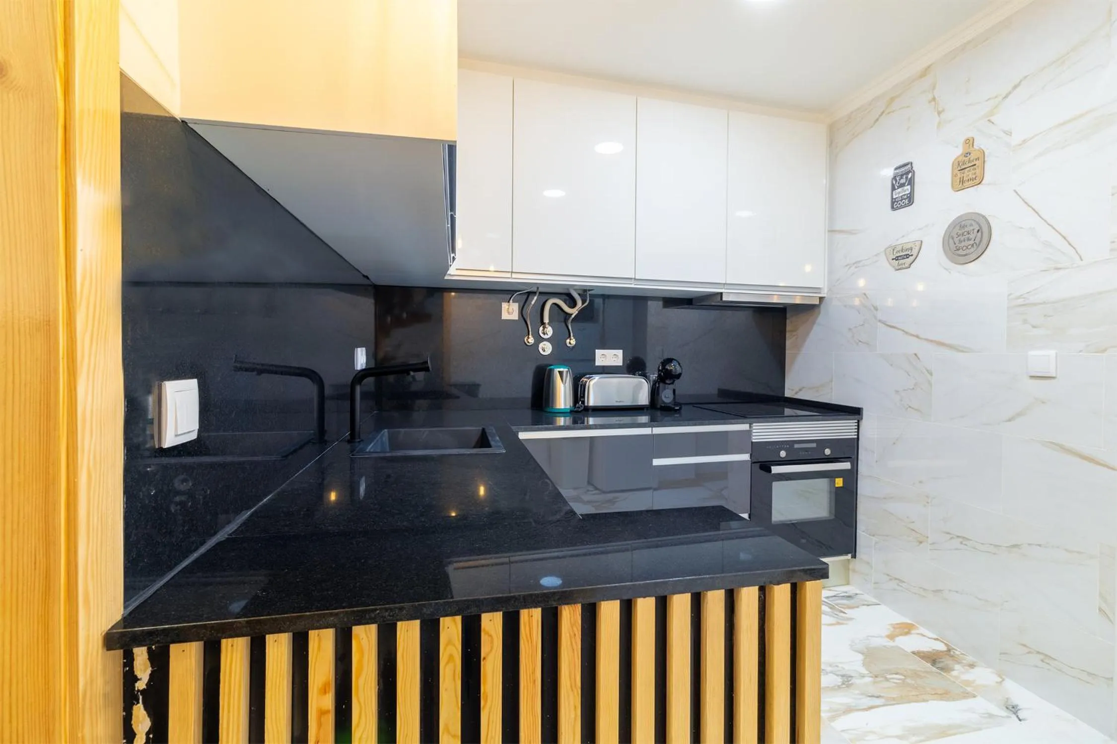 kitchen in Diario de Noticias by Central Hill Apartments
