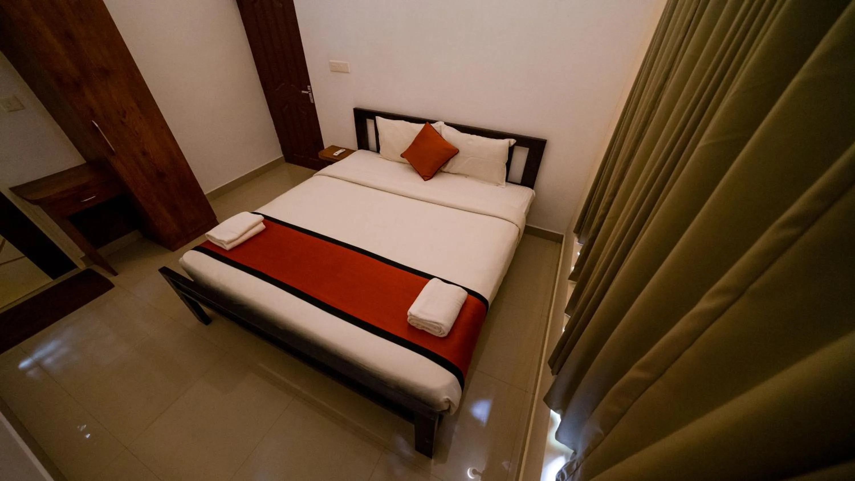 Bed in Vythiri Holiday Resort, Wayanad