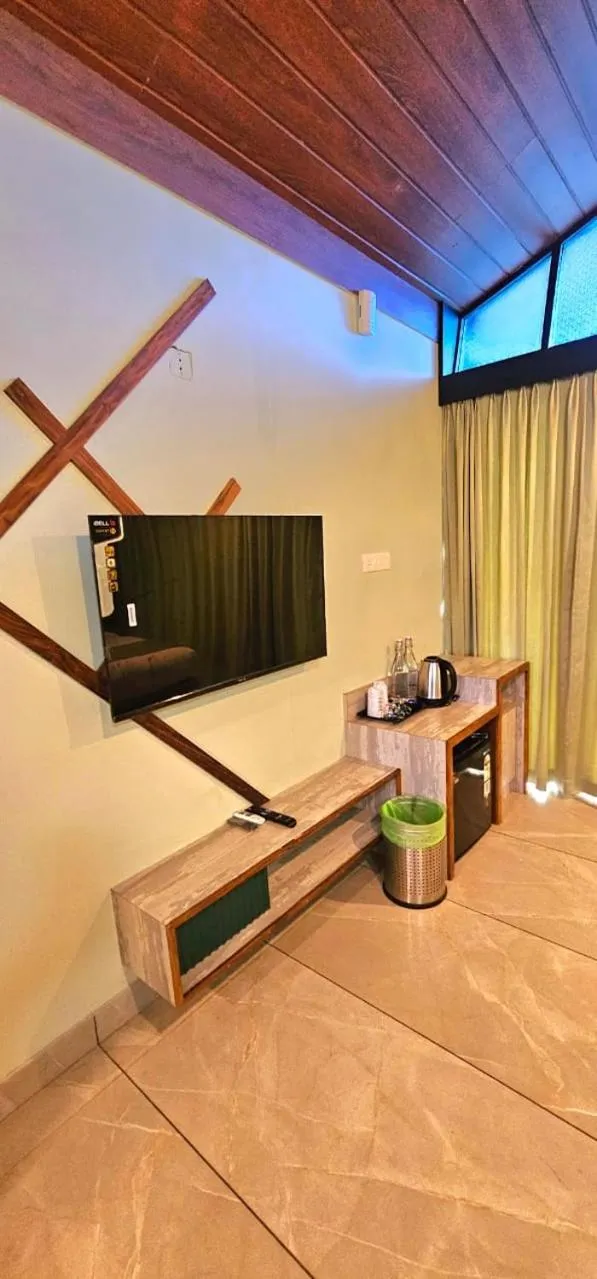 Communal lounge/ TV room in Vythiri Holiday Resort, Wayanad